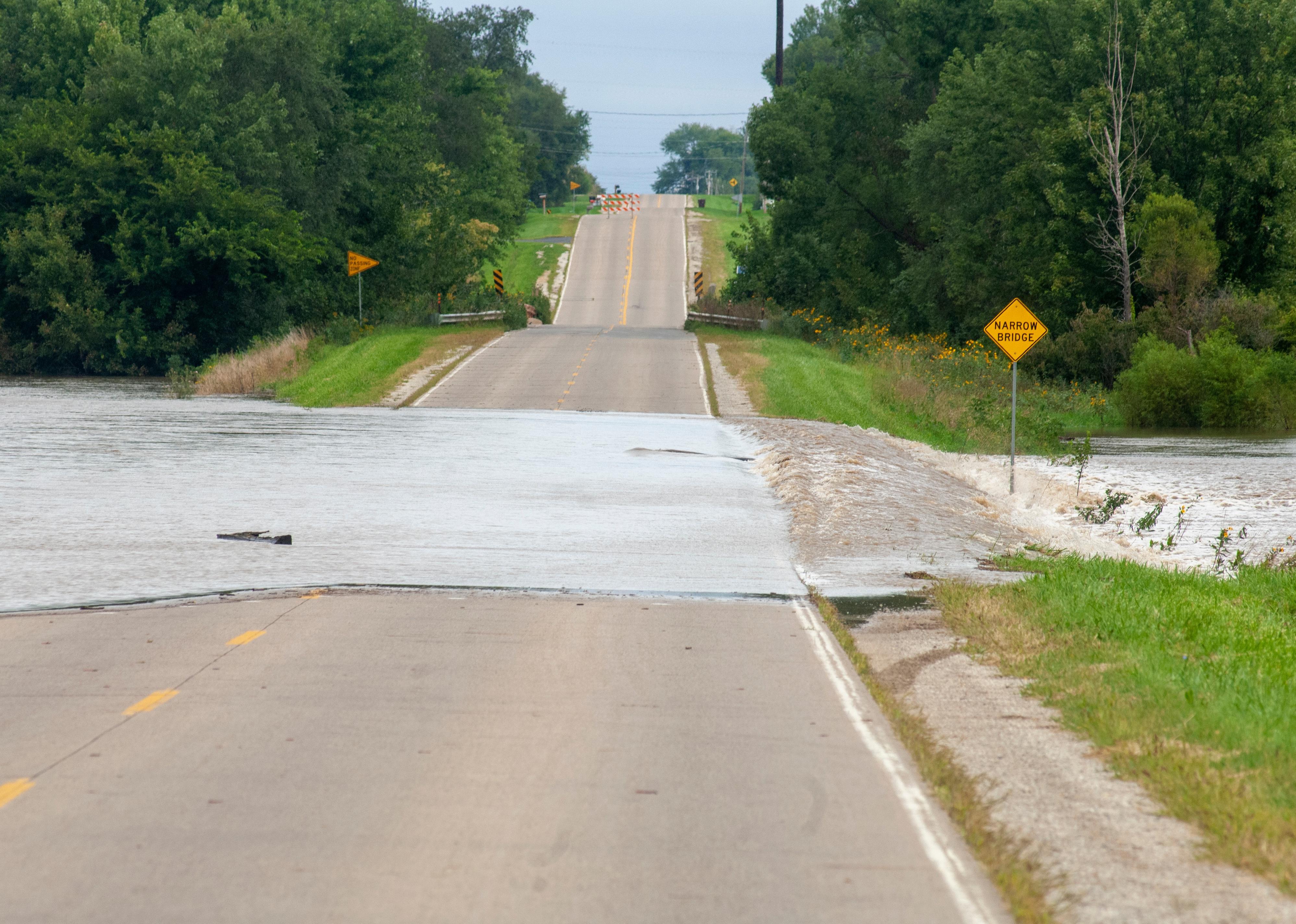 Flooding causes closures on a rural Iowa road.