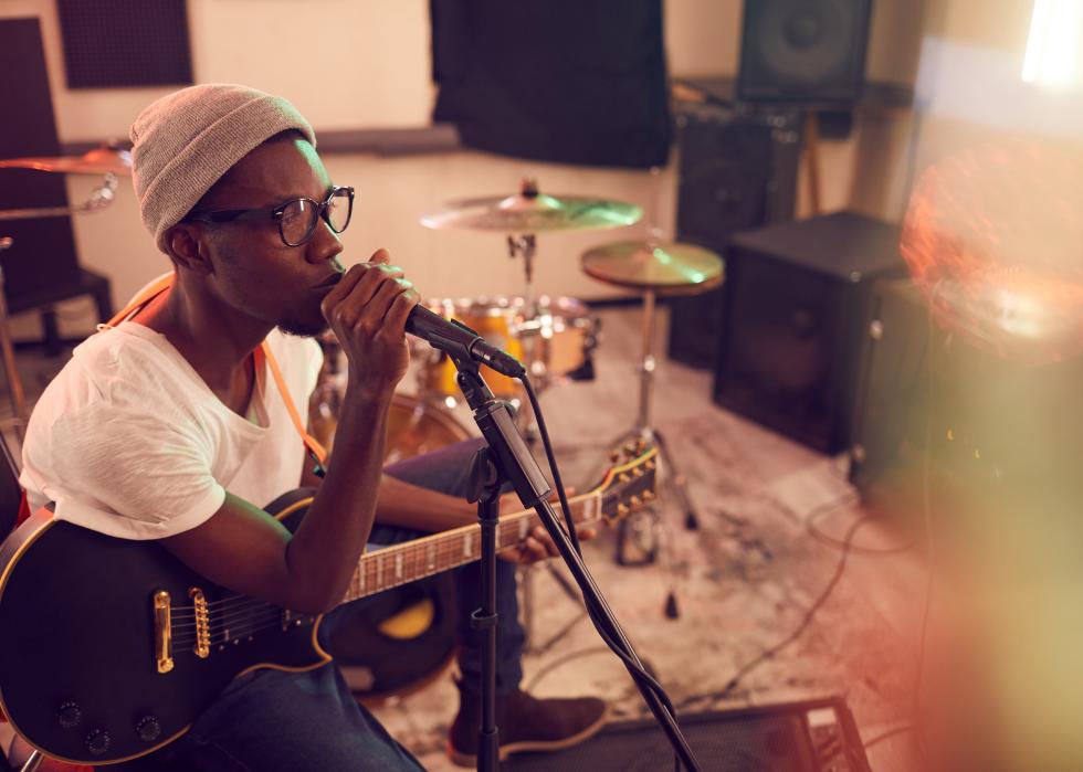 High angle of man singing in recording studio