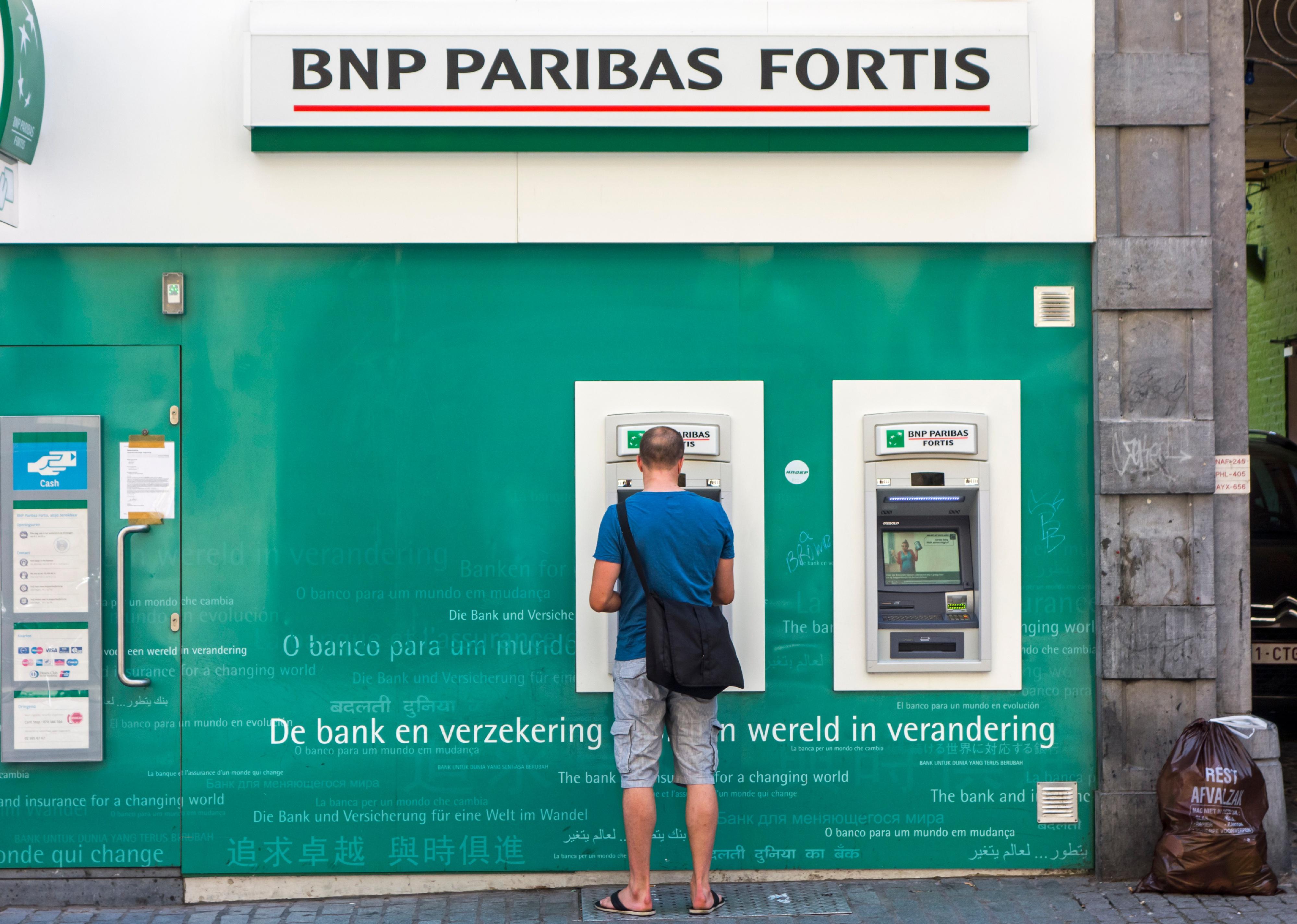 Man standing in front of ATM