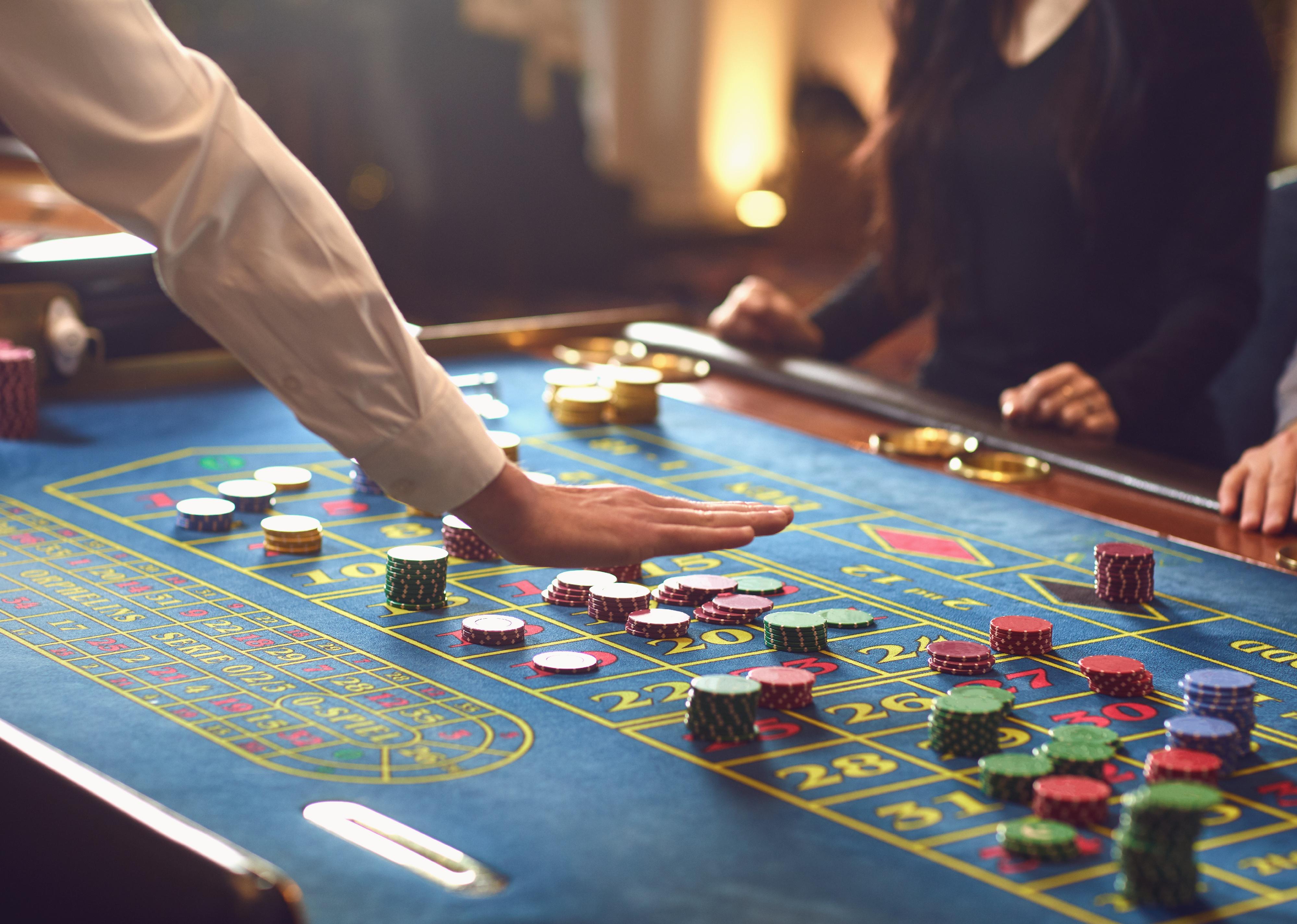 People gambling at roulette poker in a casino.