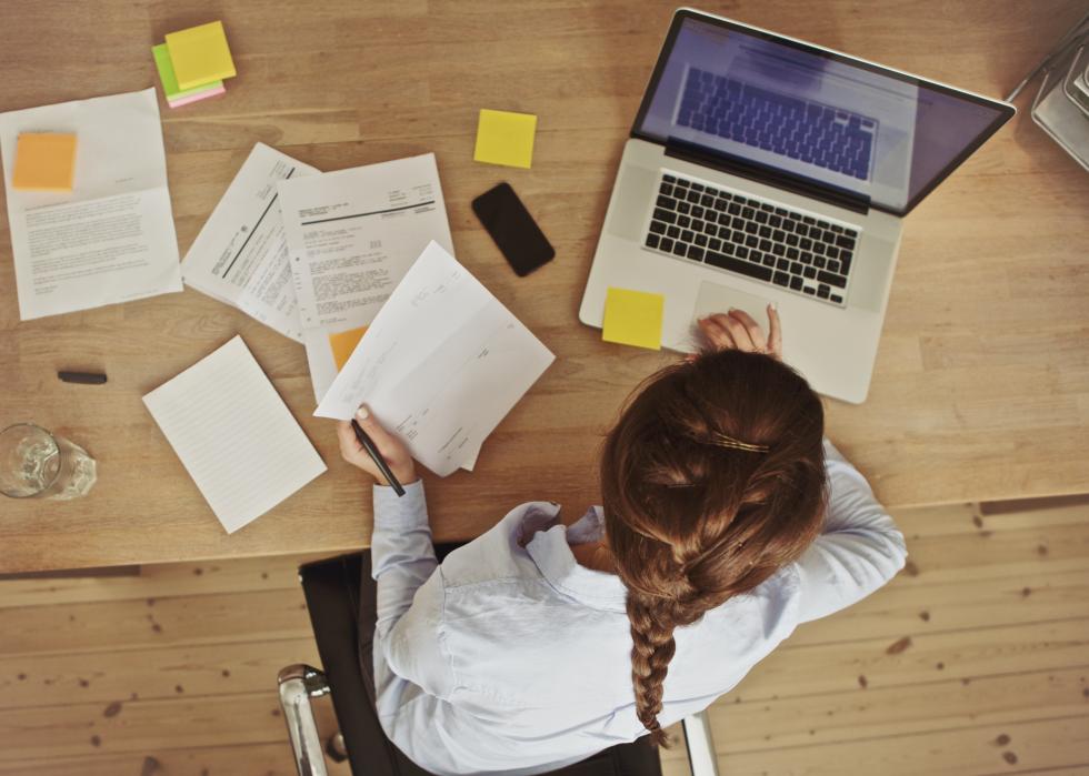 High angle view of a brunette working at her office desk