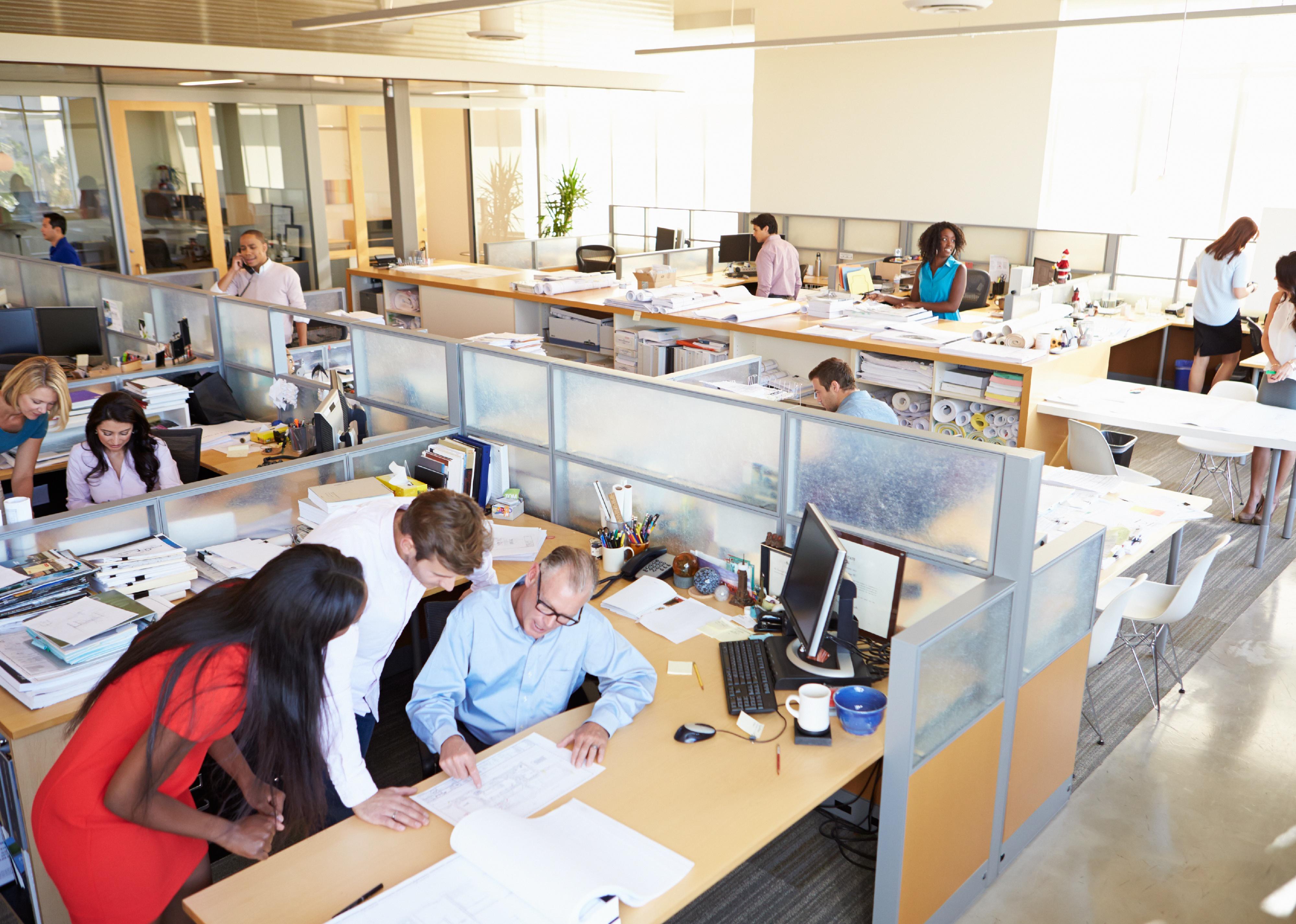 Interior of a busy modern open plan office.