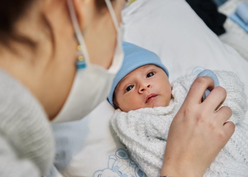 Mother looking at newborn