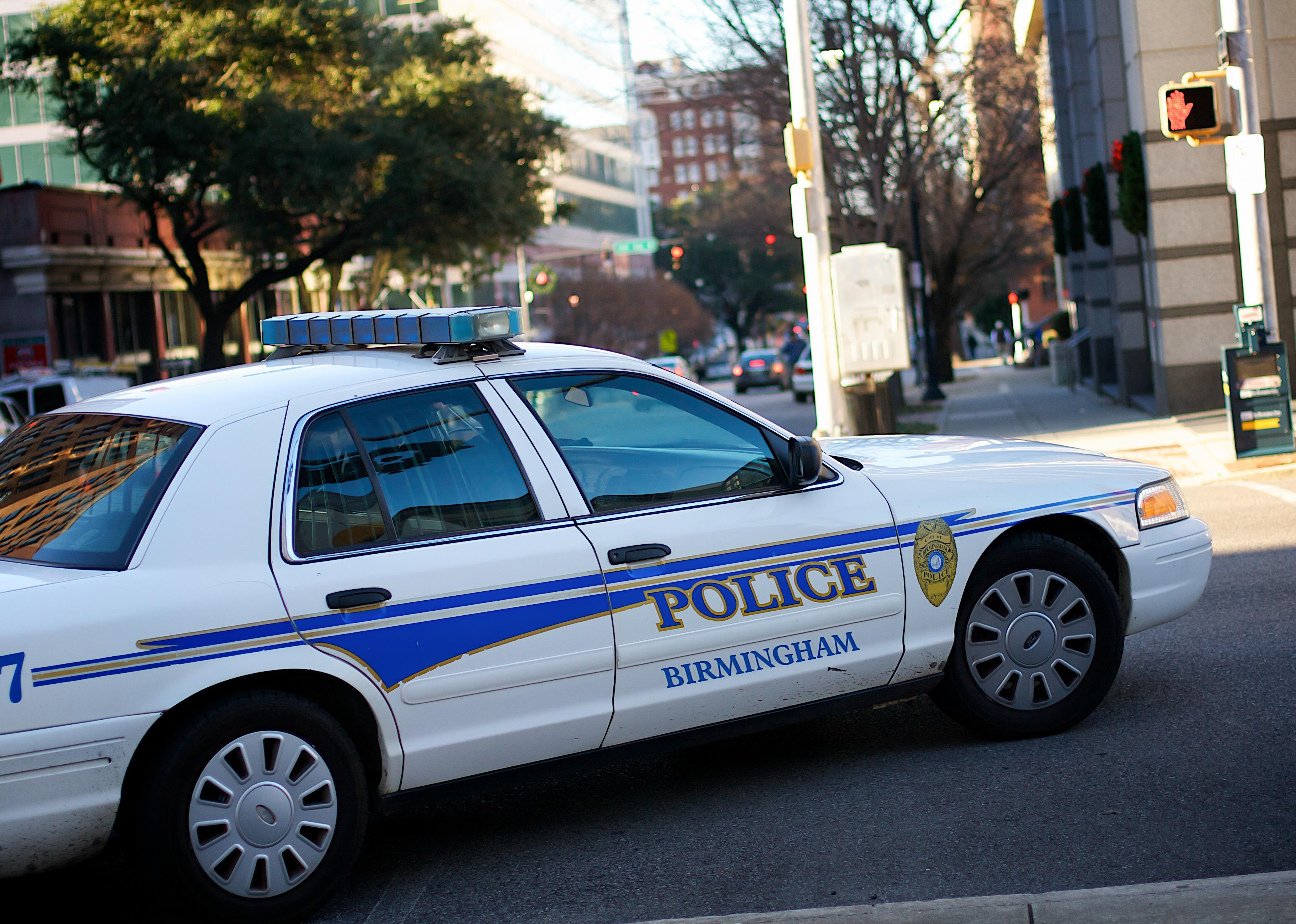 Police car turning a corner in Birmingham.