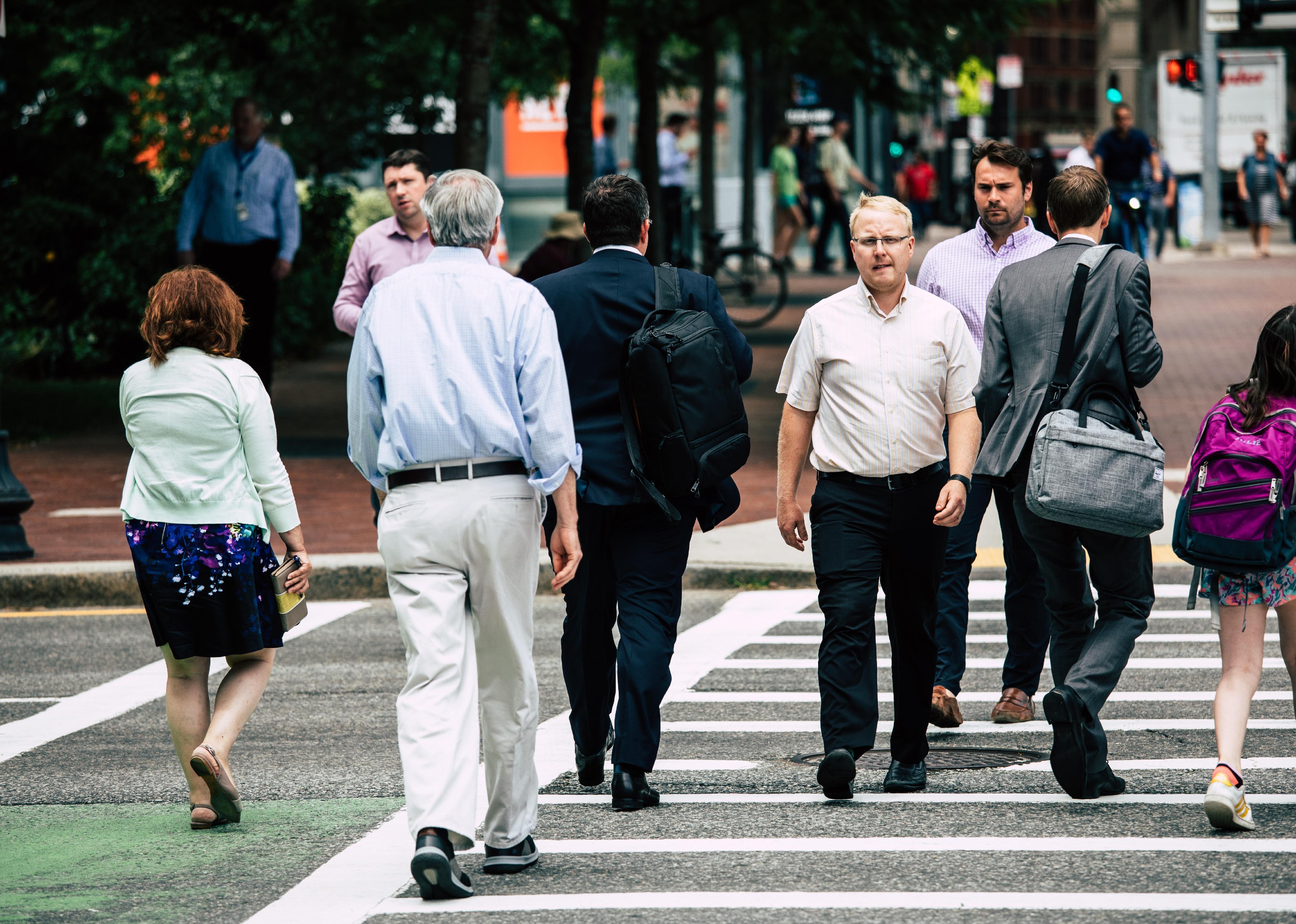 People walking to cross the road in the city at Boston, USA.