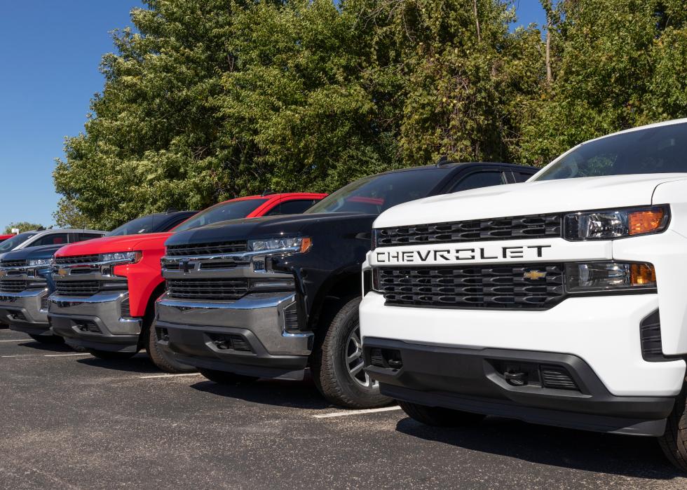 Chevrolet Silverado pickup trucks on display at a dealership.
