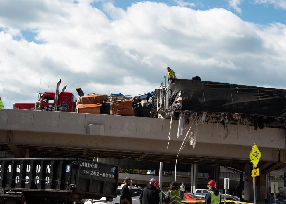 Overturned semi filled with garbage