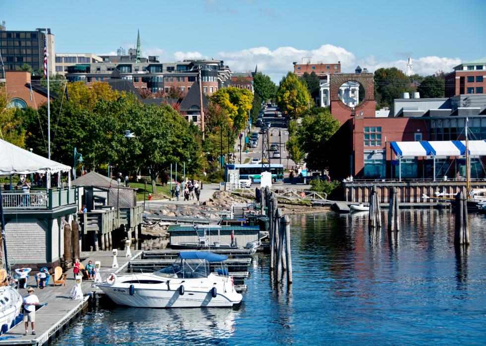 People gather to watch boats along the water at the Burlington Marina.