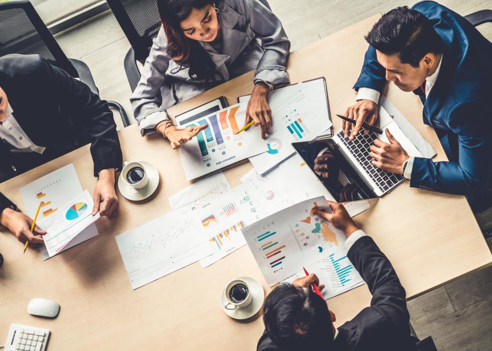 Top view of business people meeting in office.