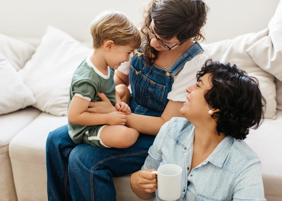 Lesbian couple playing with their son