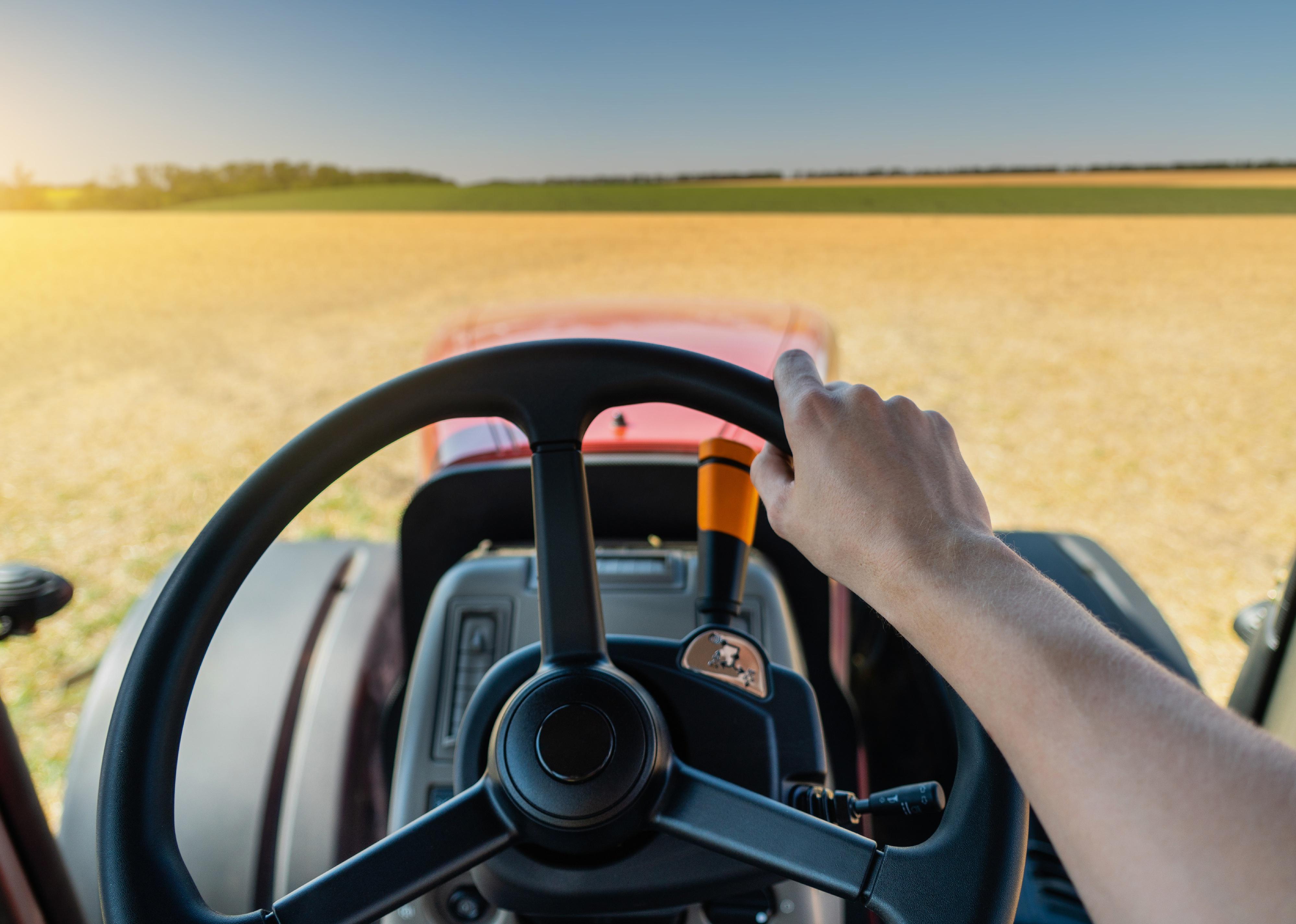 First-person view of tractor streering wheel.