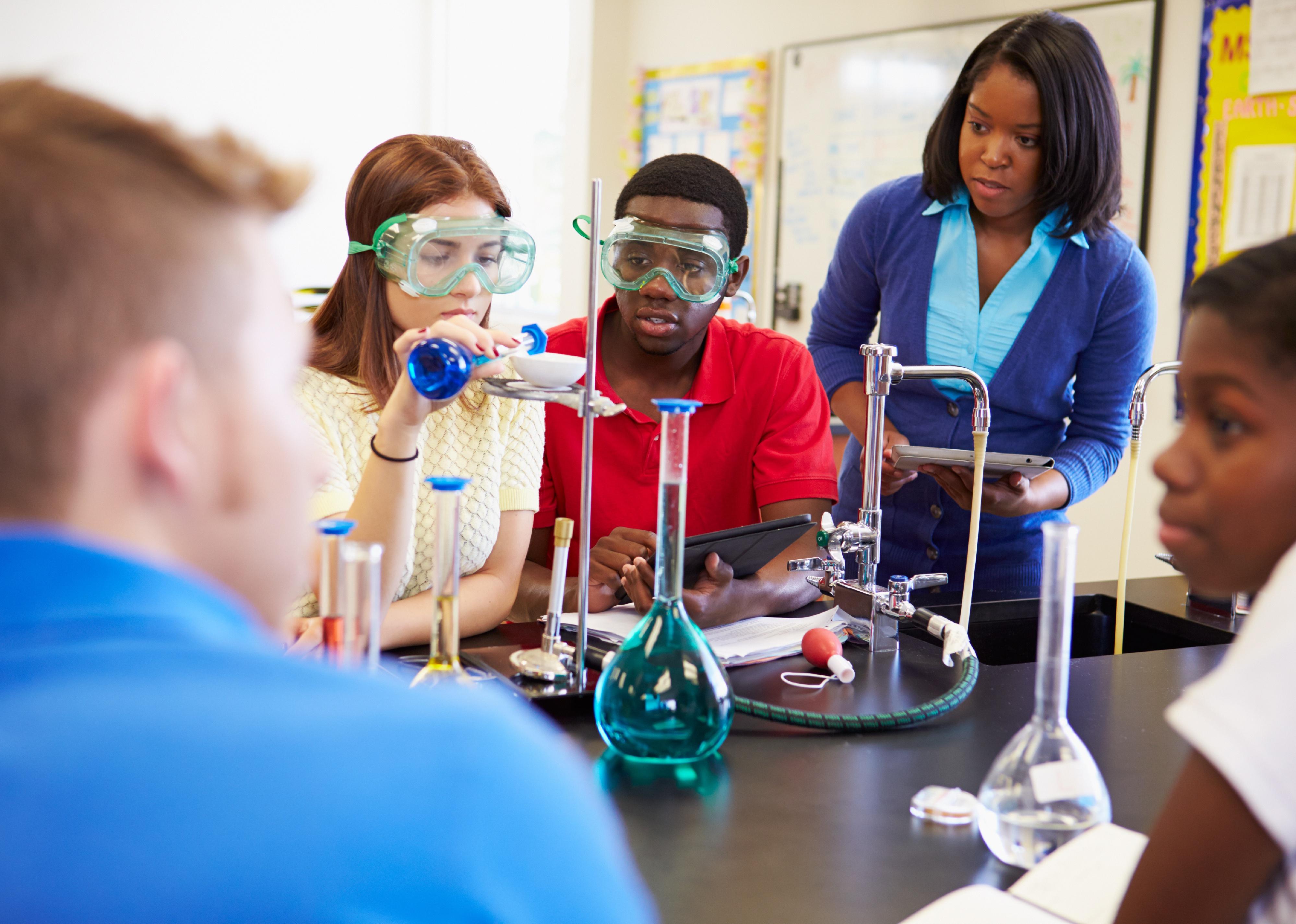 Teacher and students in science classroom