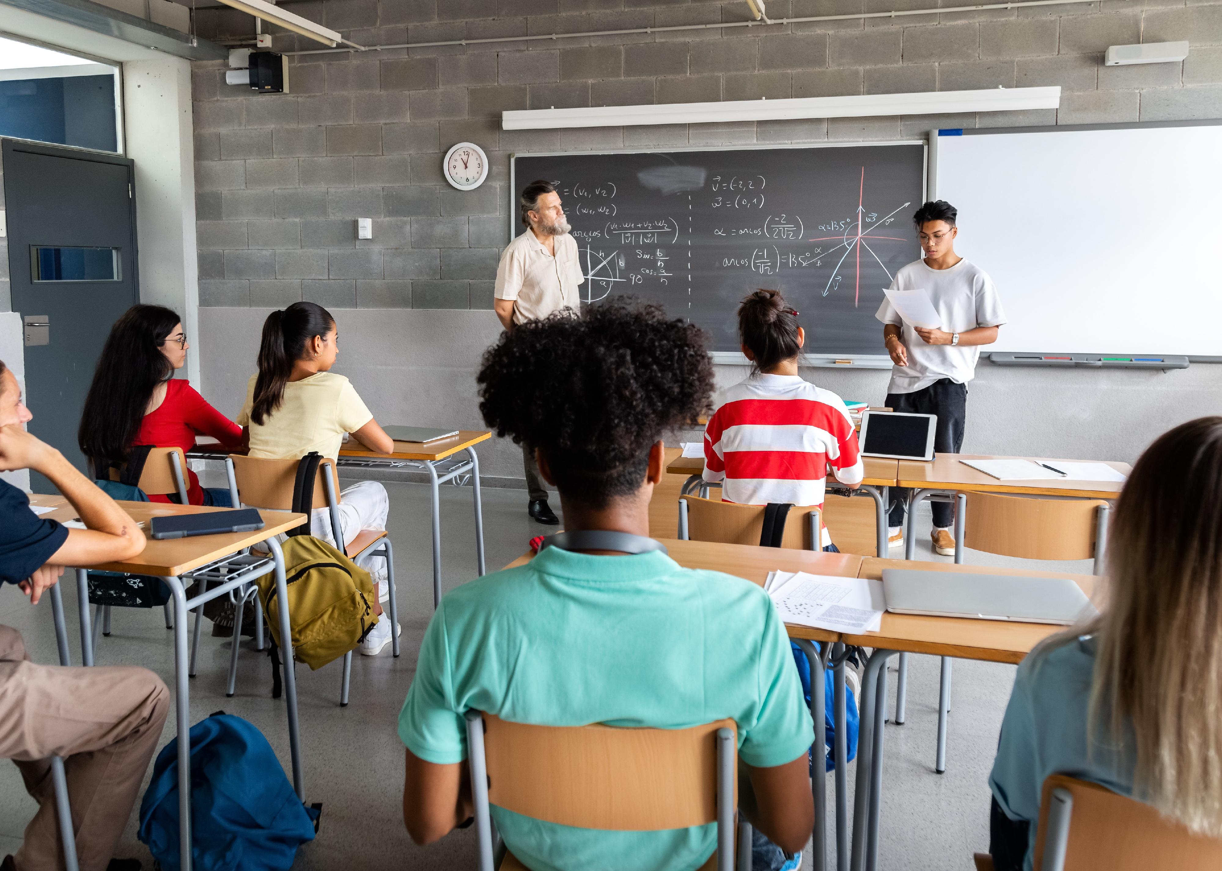 High school student giving a presentation in class