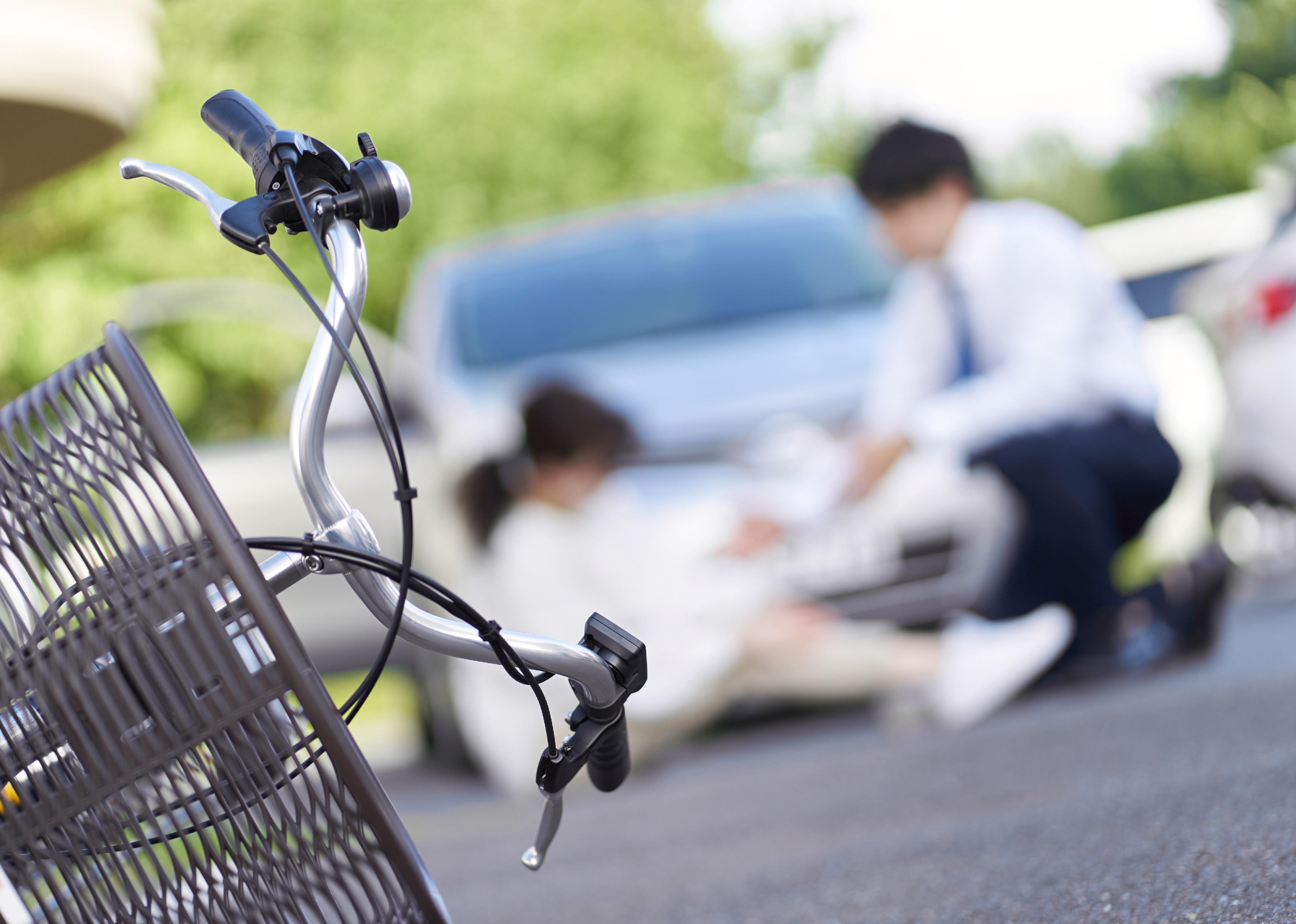 Bicycle in front of a blurred accident scene.