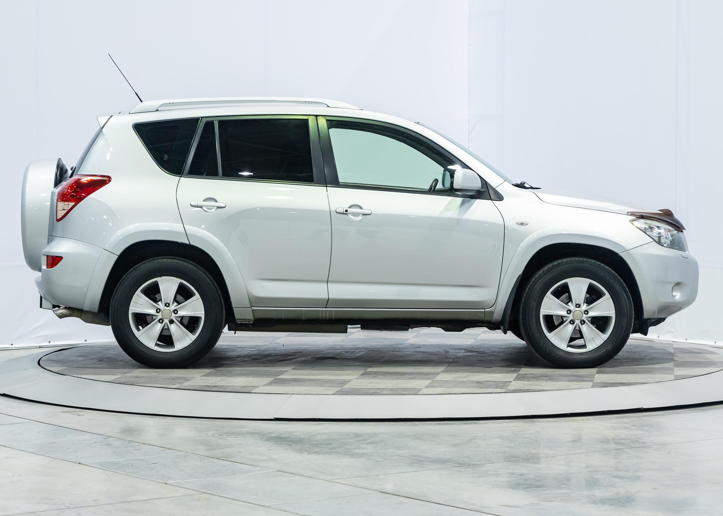 Side view of a white Toyota RAV-4.