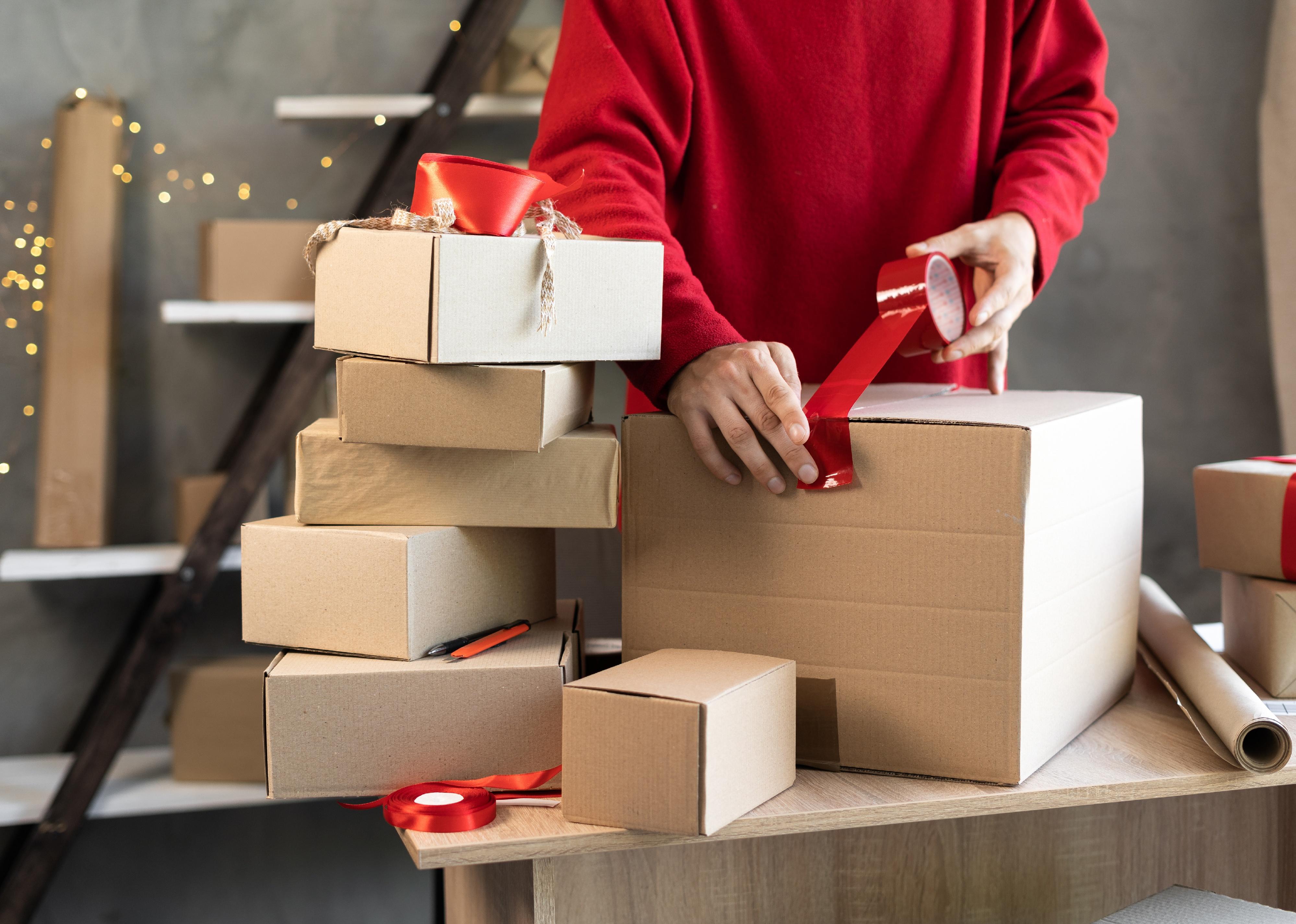 Man packing boxes for shipment.