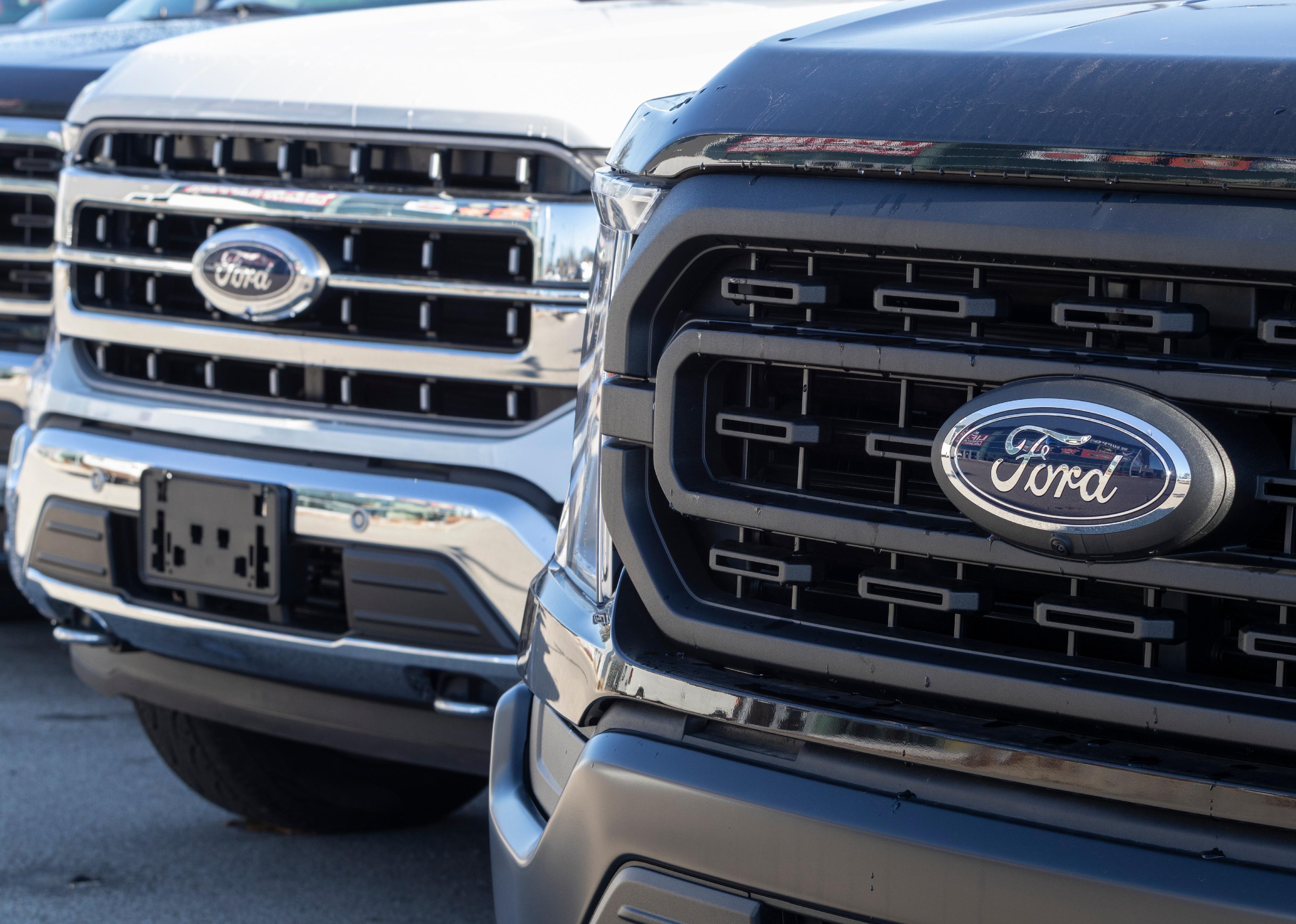 Three Ford F-Series Trucks in a row.