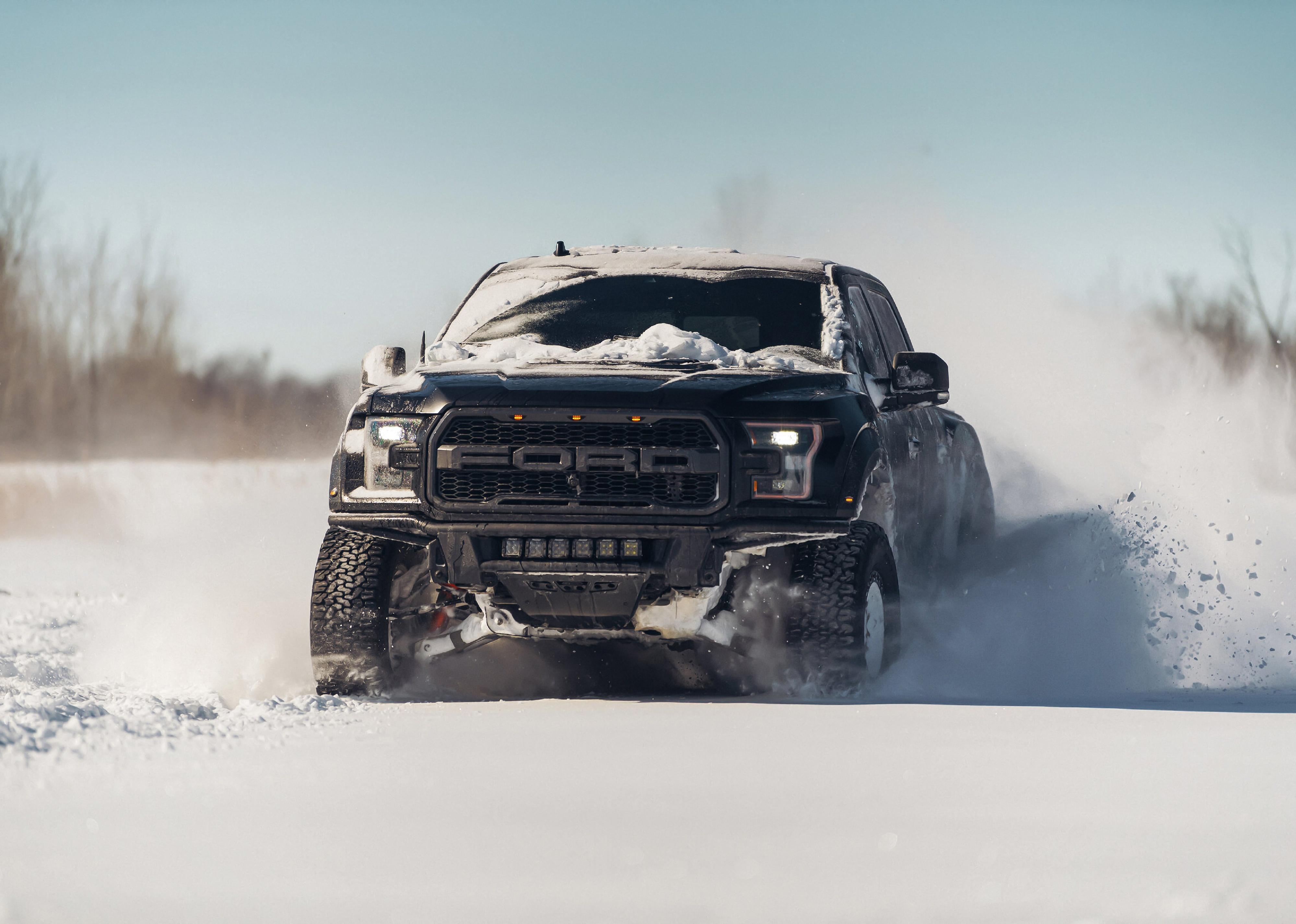 Ford F-150 Raptor in snow.