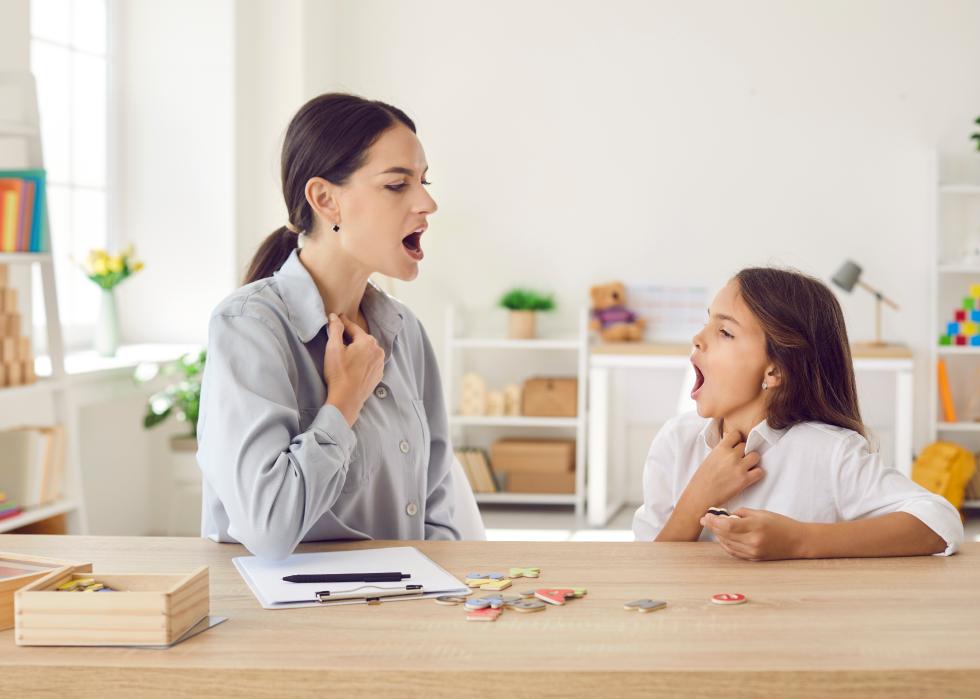 Speech-language pathologist working on a child's pronunciation.