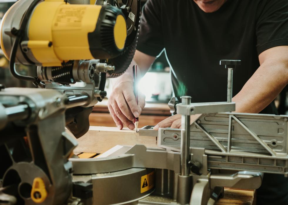 Close up of a carpenter using a Miter saw table