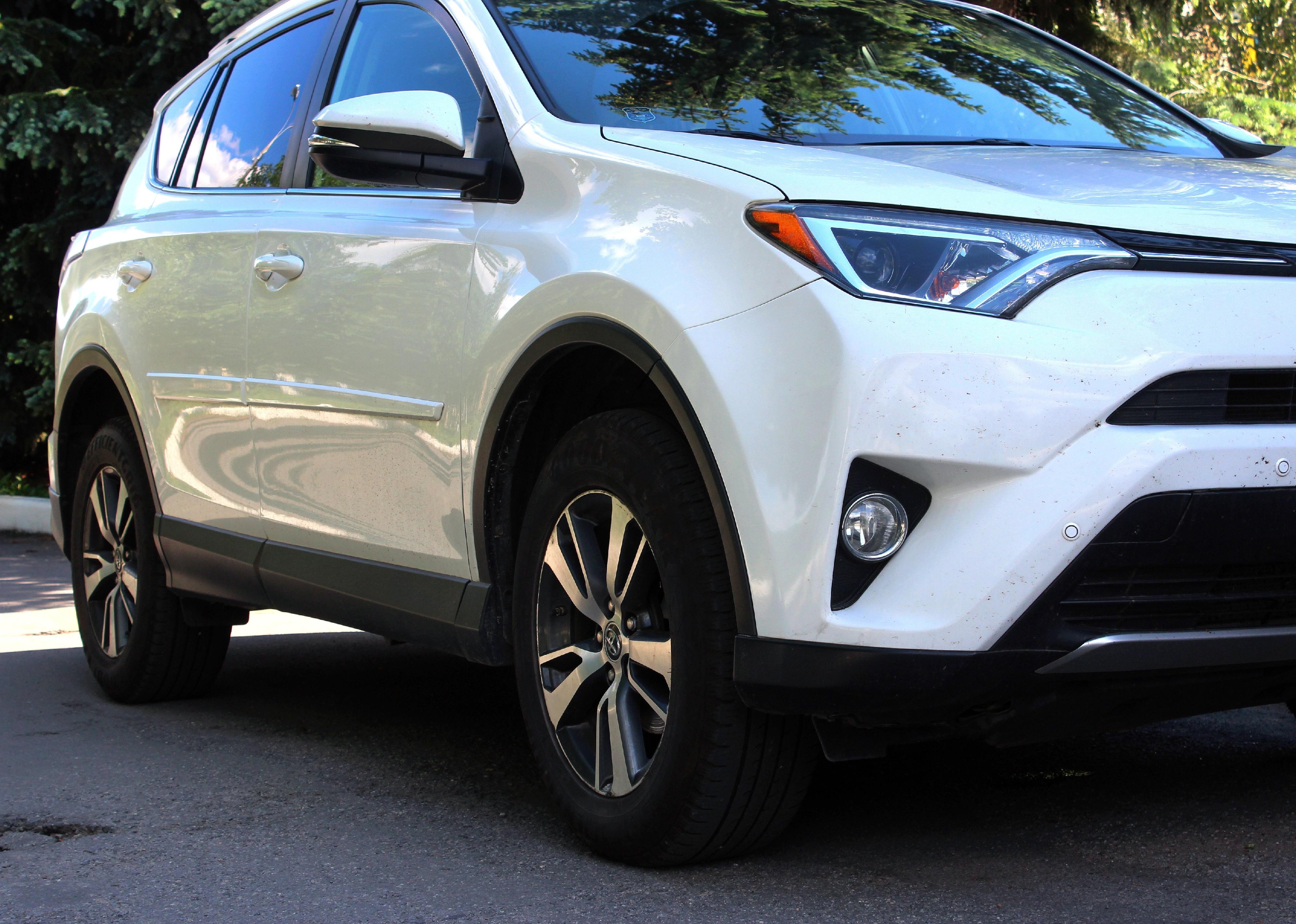 White Toyota RAV4 right side of the car.