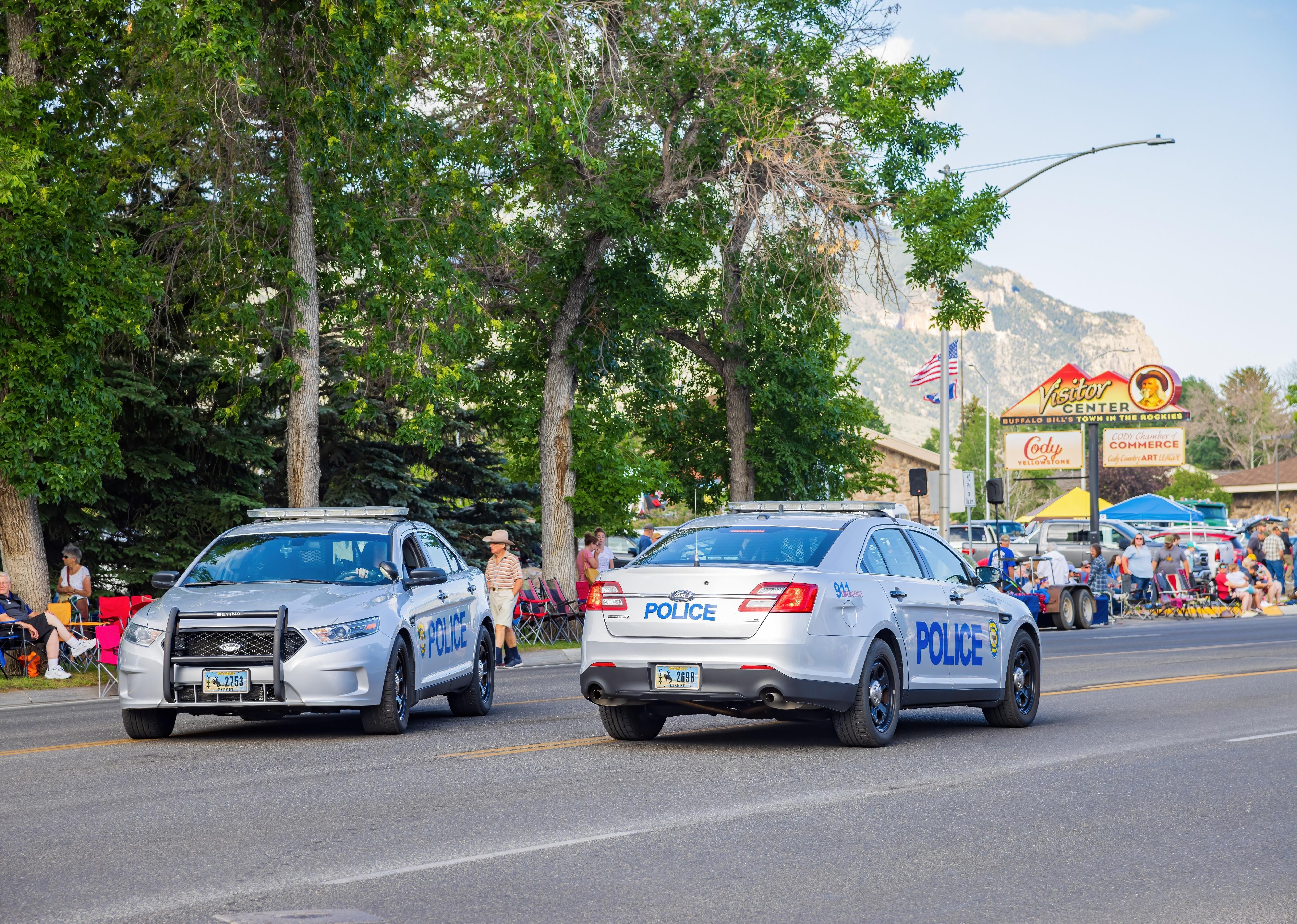 Wyoming police cars on the road.