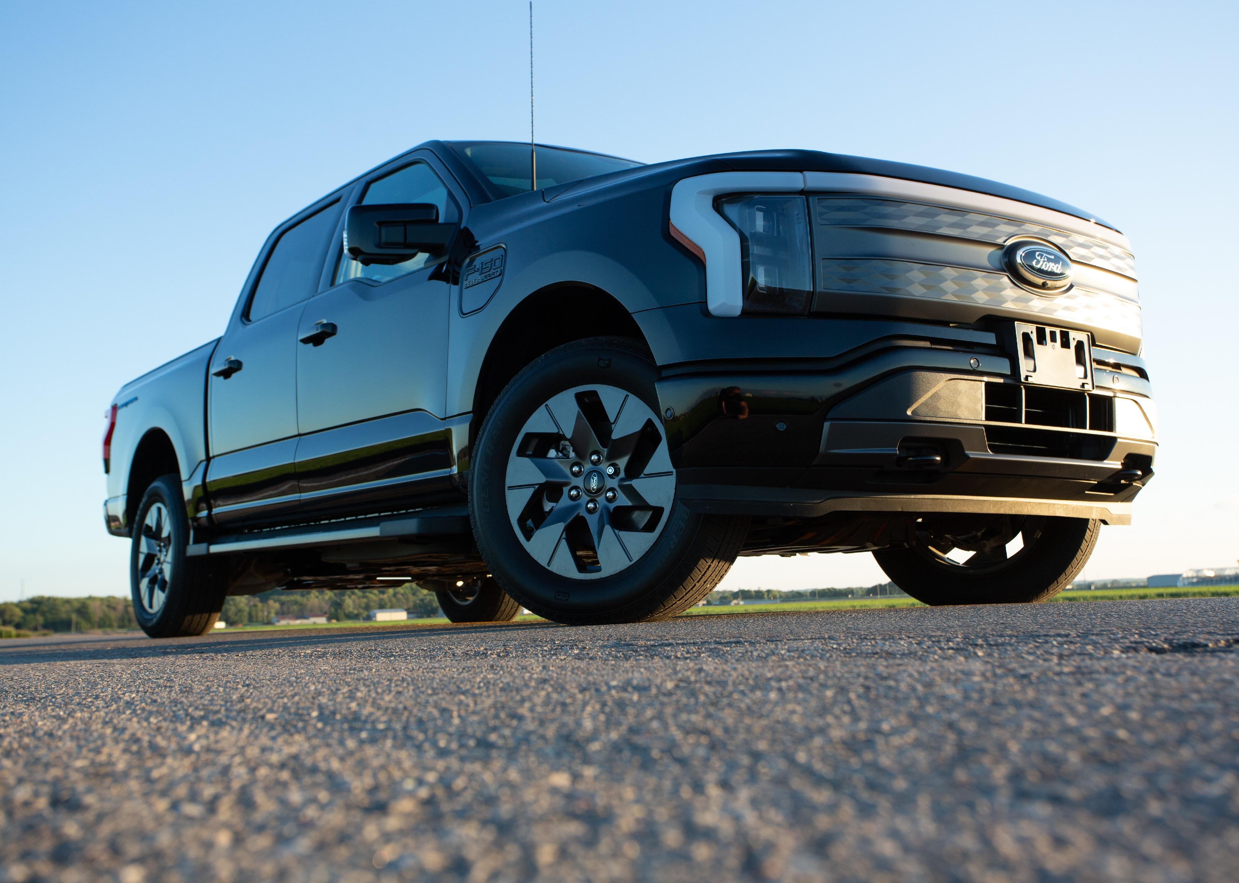 Upward angle of a black Ford F150 driving.