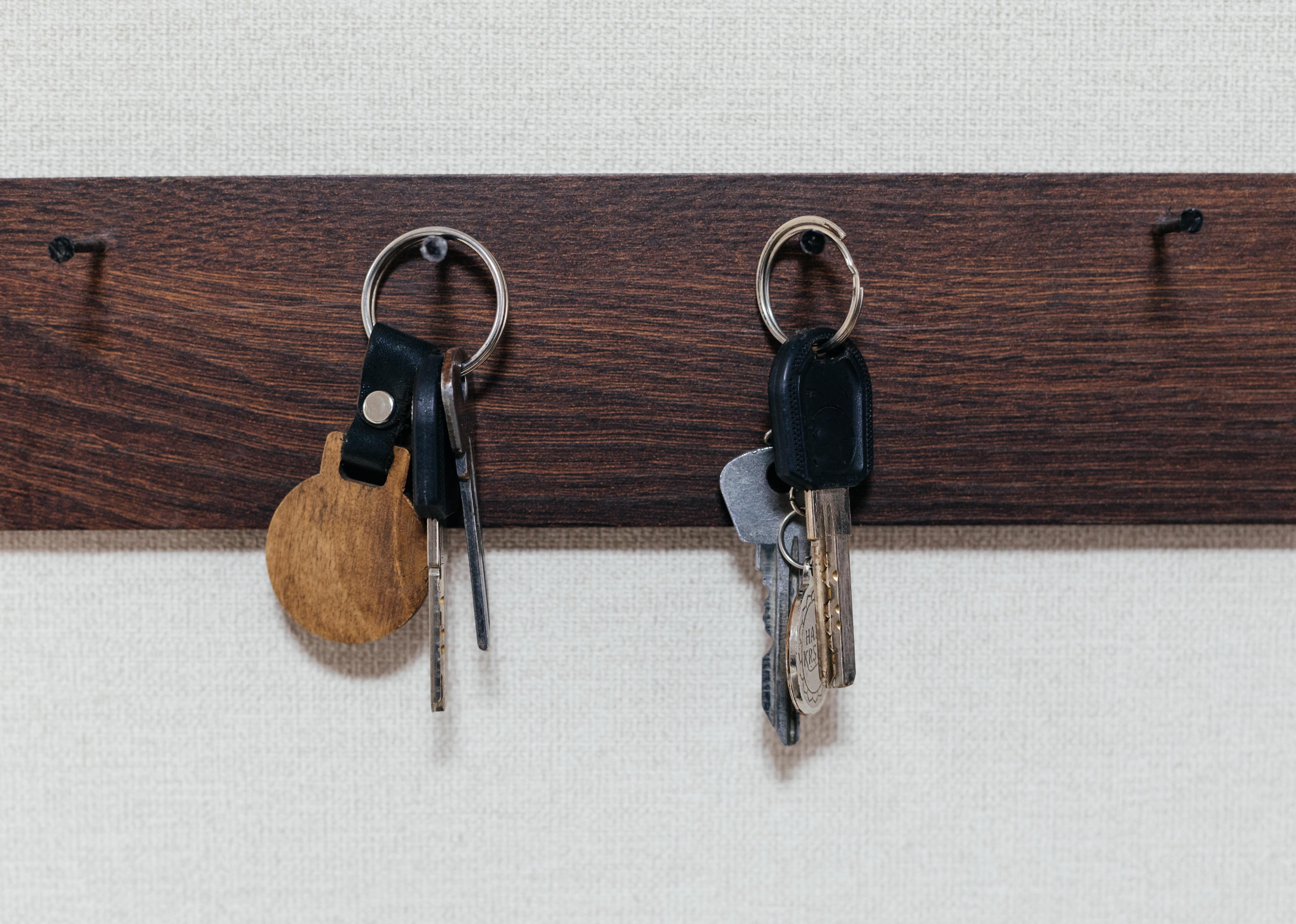 Key holder with keys hanging on the wall.