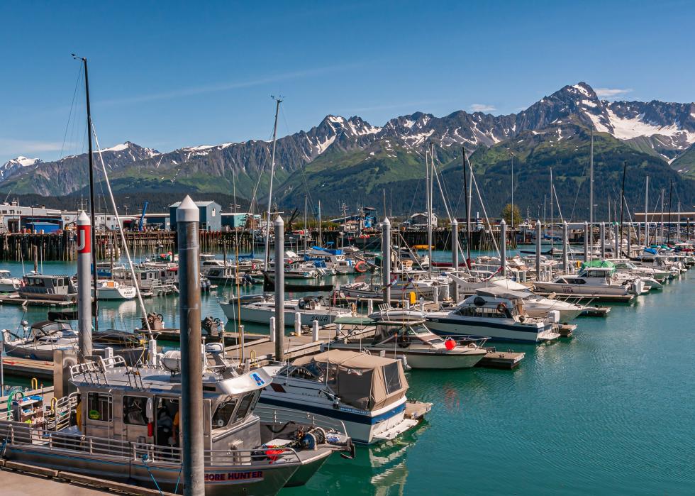 Small boat piers and docking slots on greenish Resurrection Bay water.