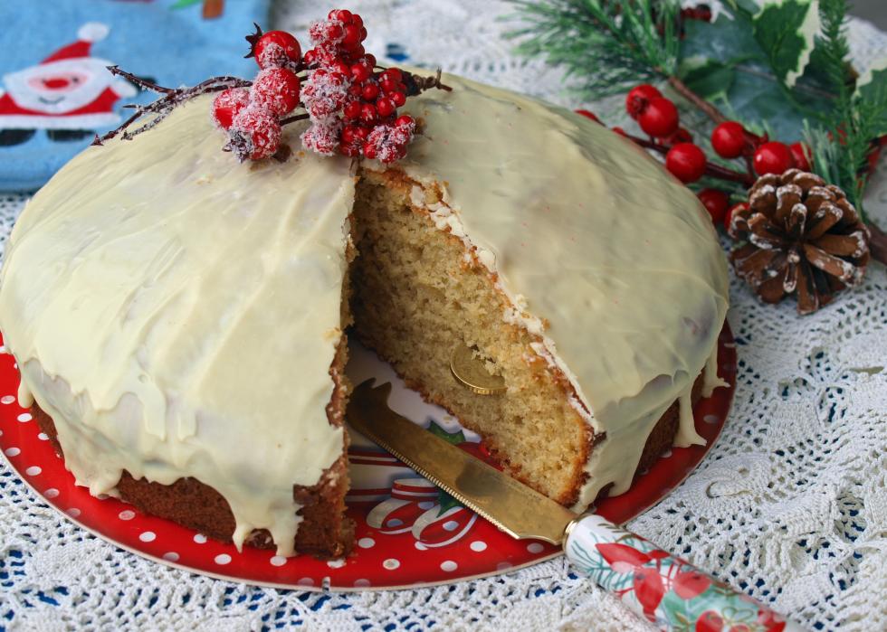 Homemade Greek Vasilopita covered in white chocolate icing.