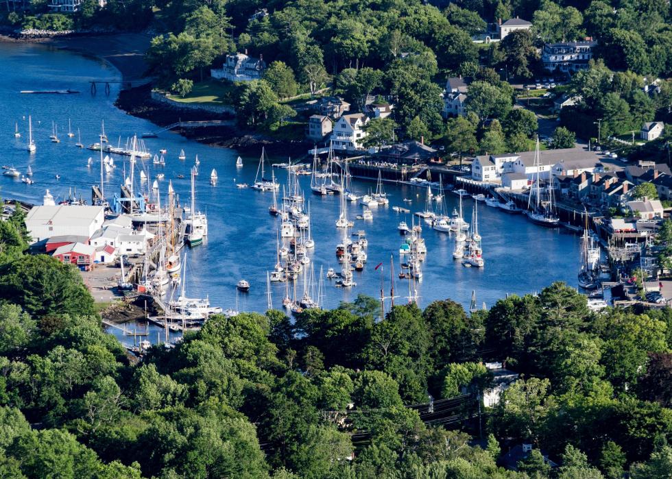 A high-angle view of a harbor full of docket boats in Camden, Maine.