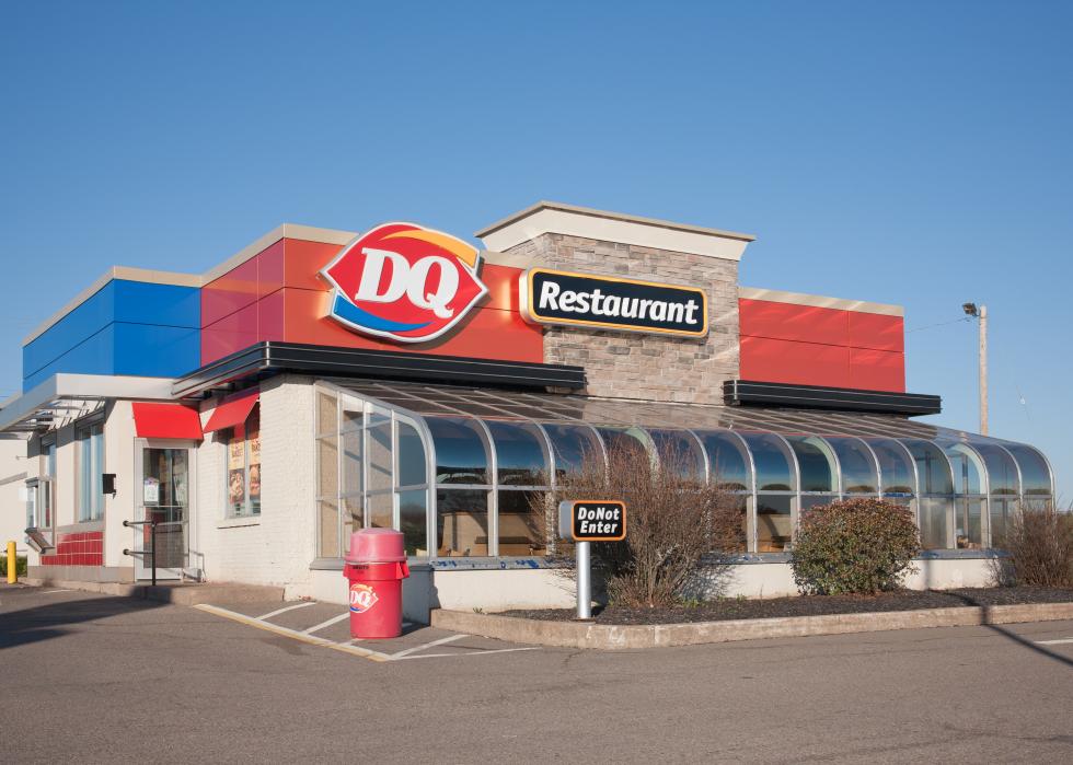 A standalone Dairy Queen restaurant with a drive thru.