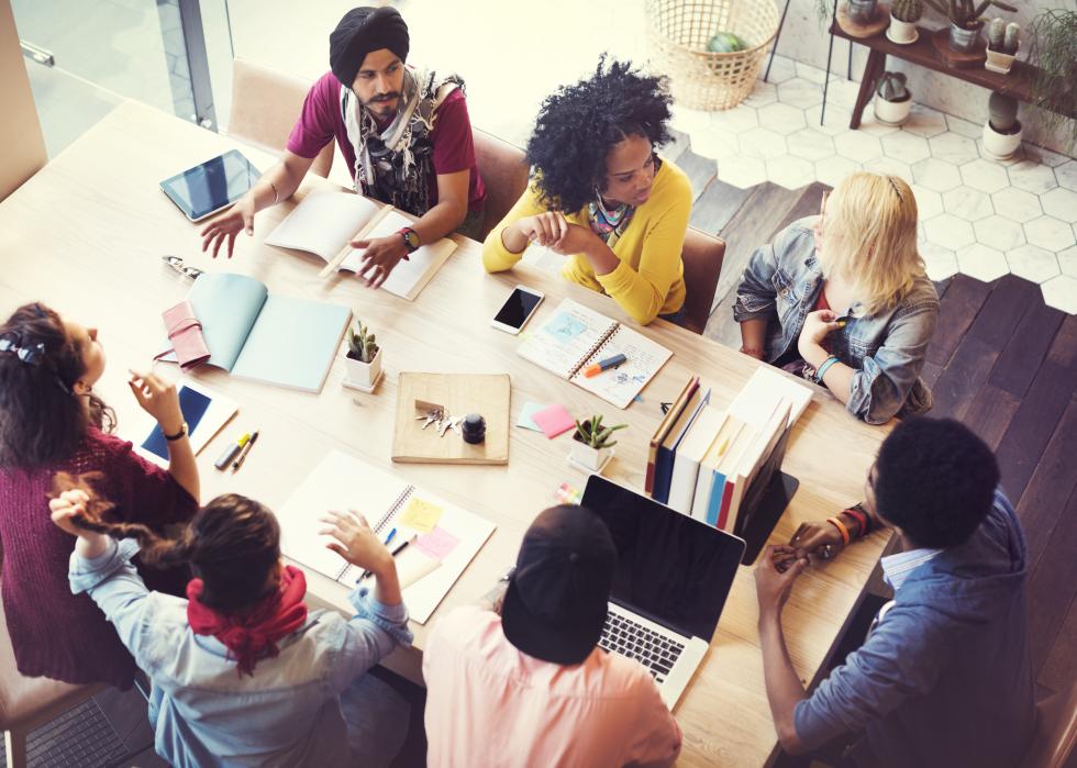 High angle shot of group of people working together at a table