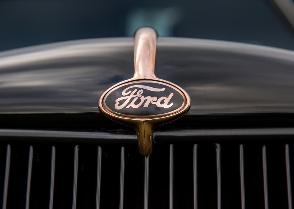 Vintage Ford truck black and gold logo and grill.