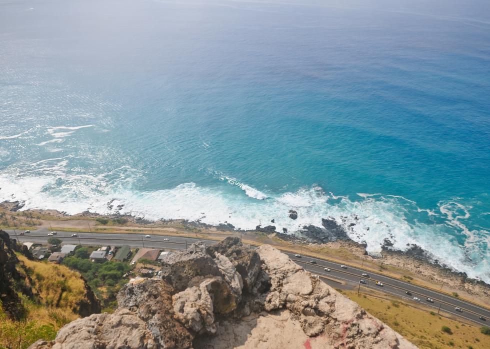 High aerial view of highway along the coast.