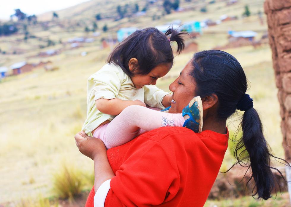 Side view of happy mother and child