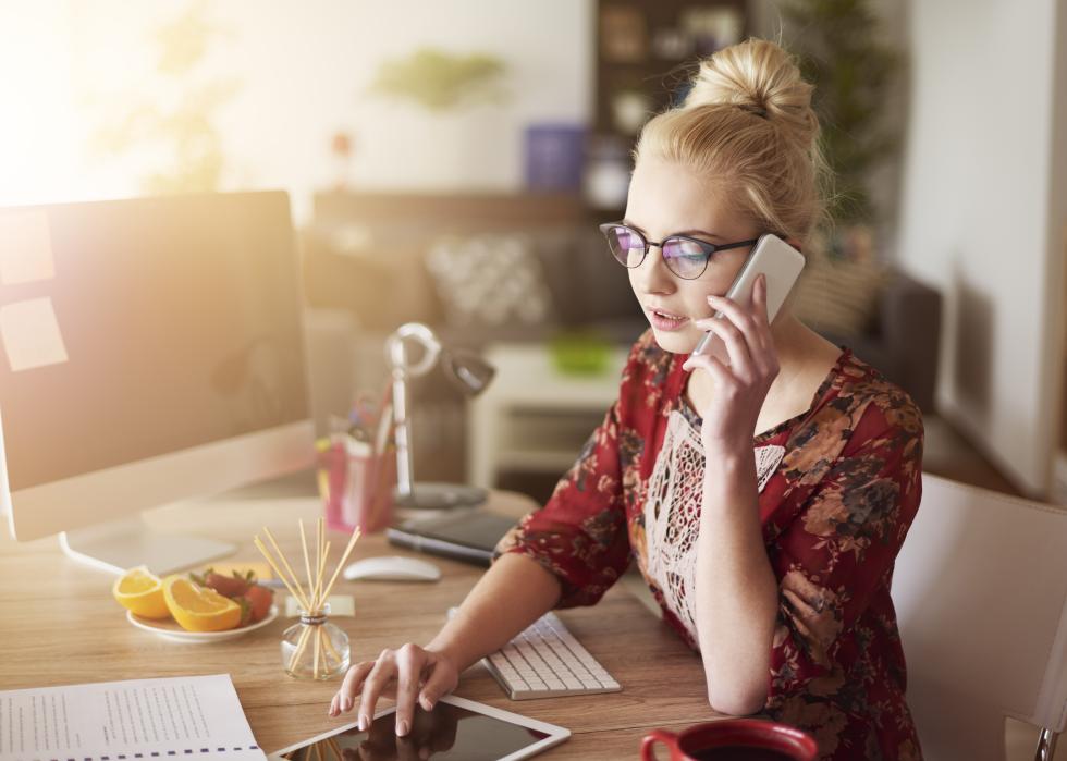 Woman surrounded with digital devices