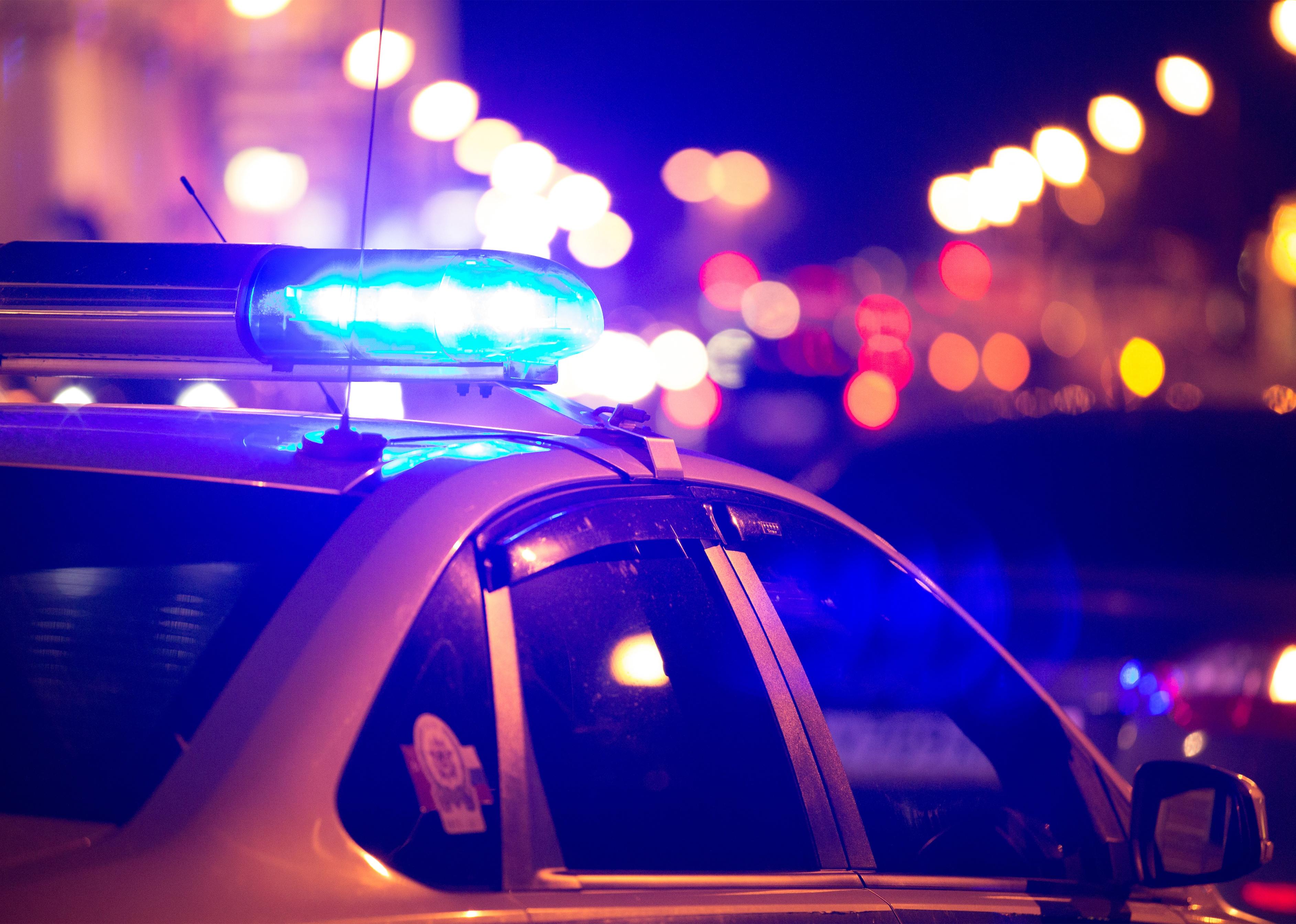 Blue light flasher atop of a police car. 