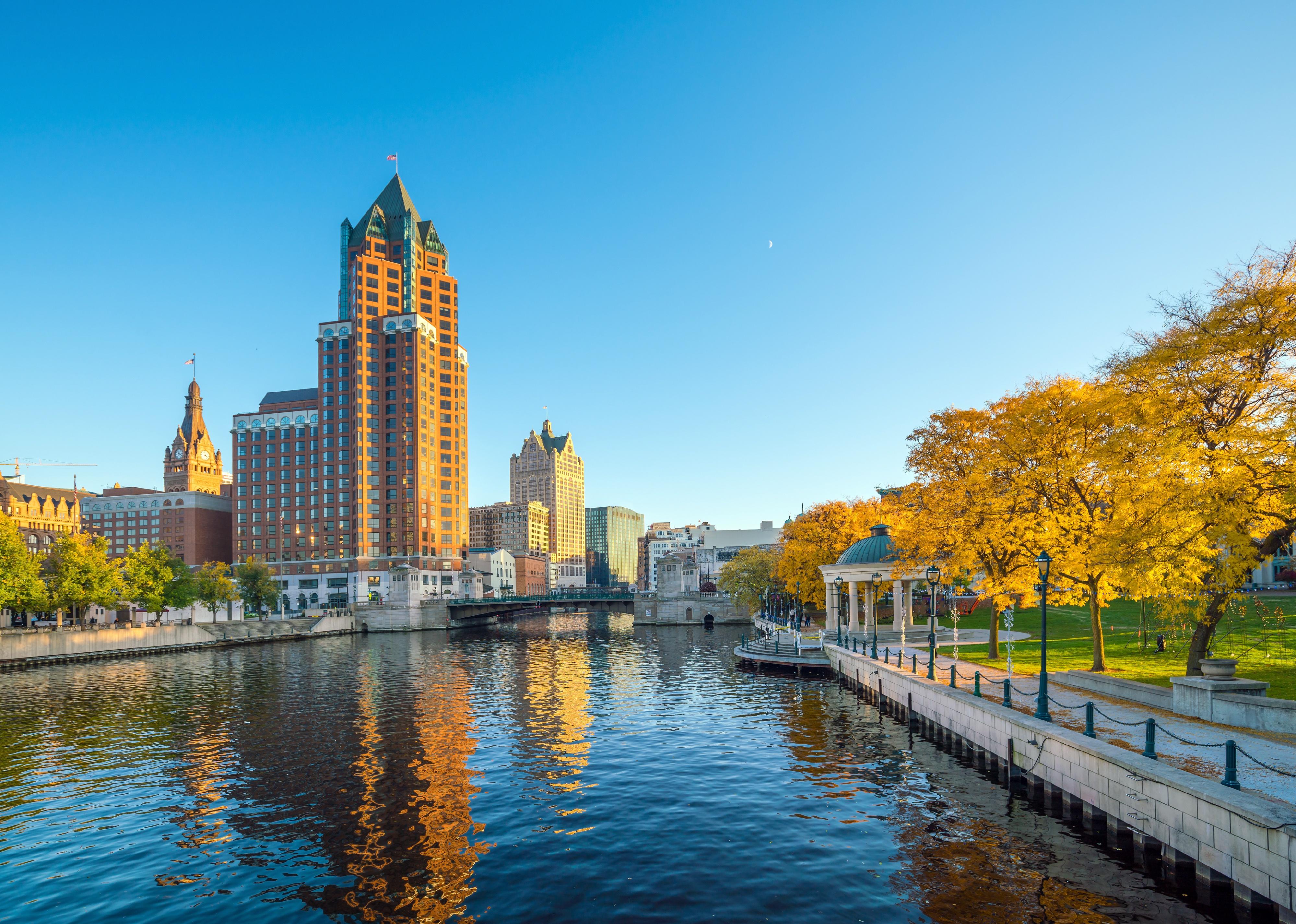 Downtown skyline with buildings along the Milwaukee river.