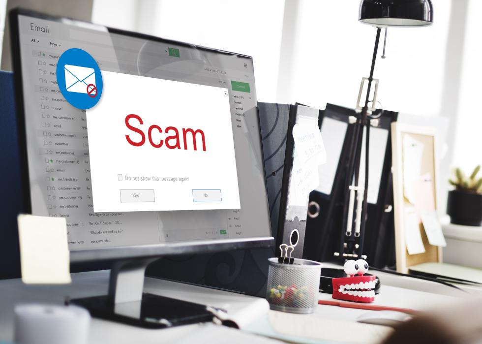 Email inbox with a pop-up scam alert window.