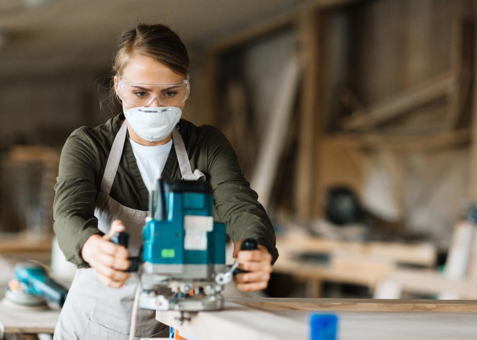 Woman working with fretsaw