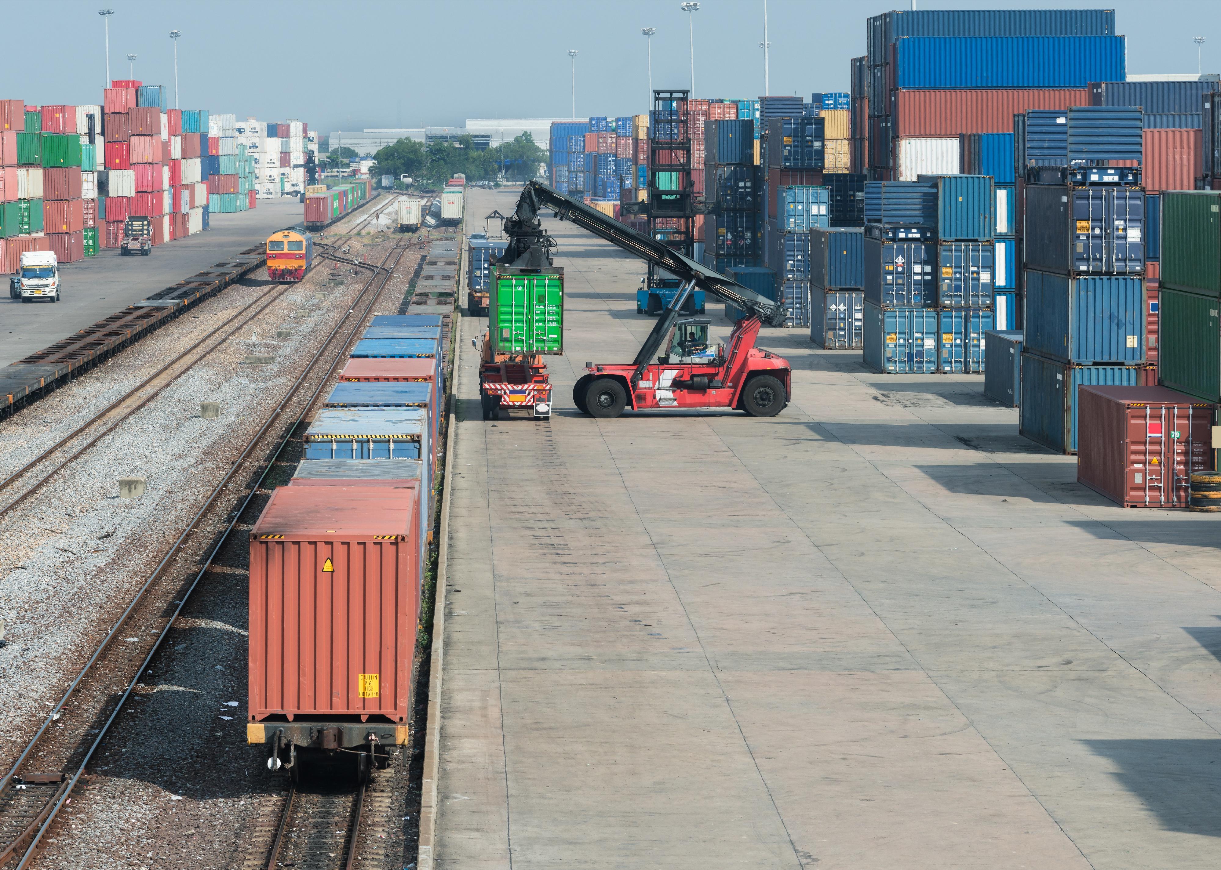 Cargo train platform with freight train container.