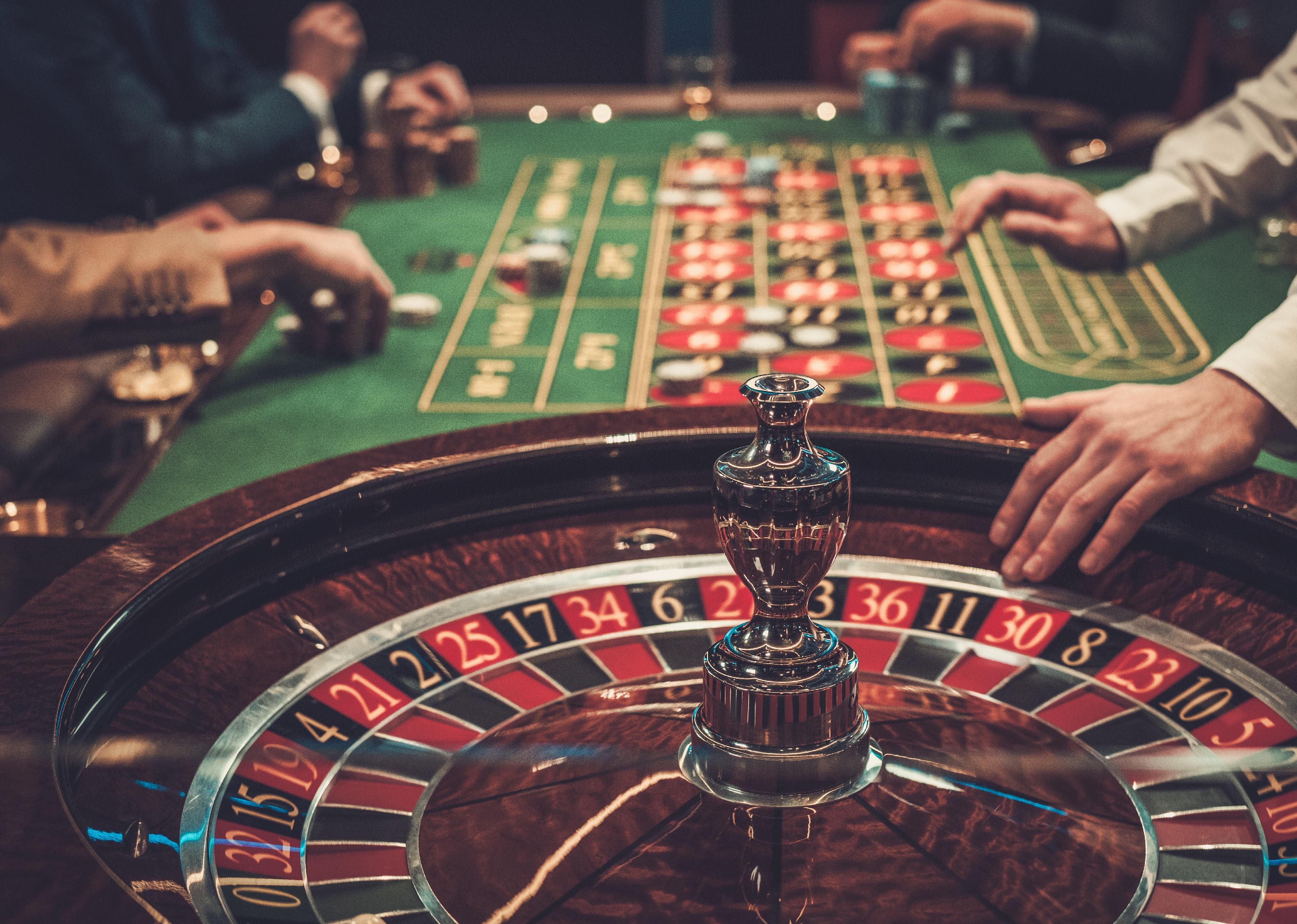 Side view of a roulette table in a luxury casino.