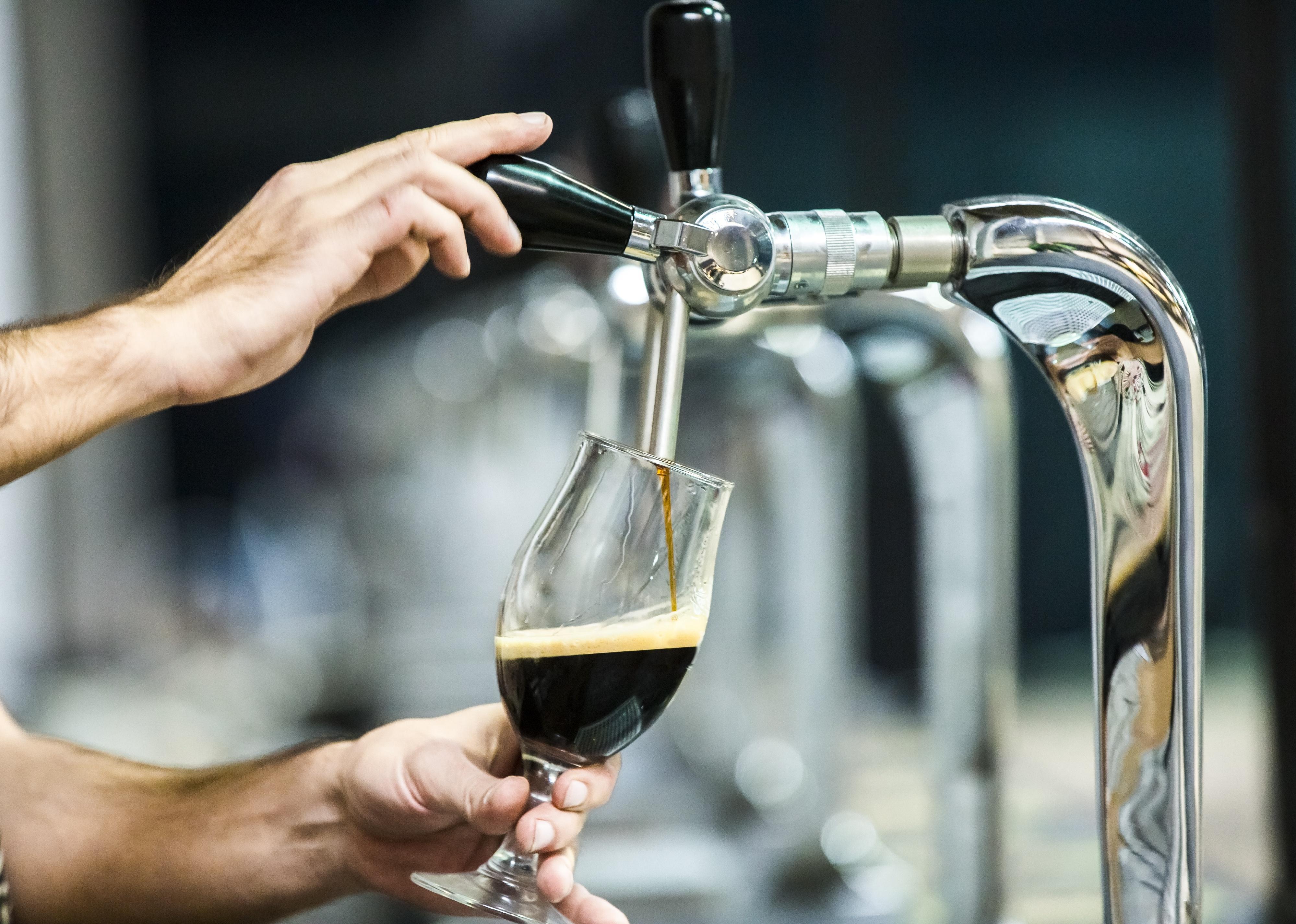Stout beer pouring in a glass