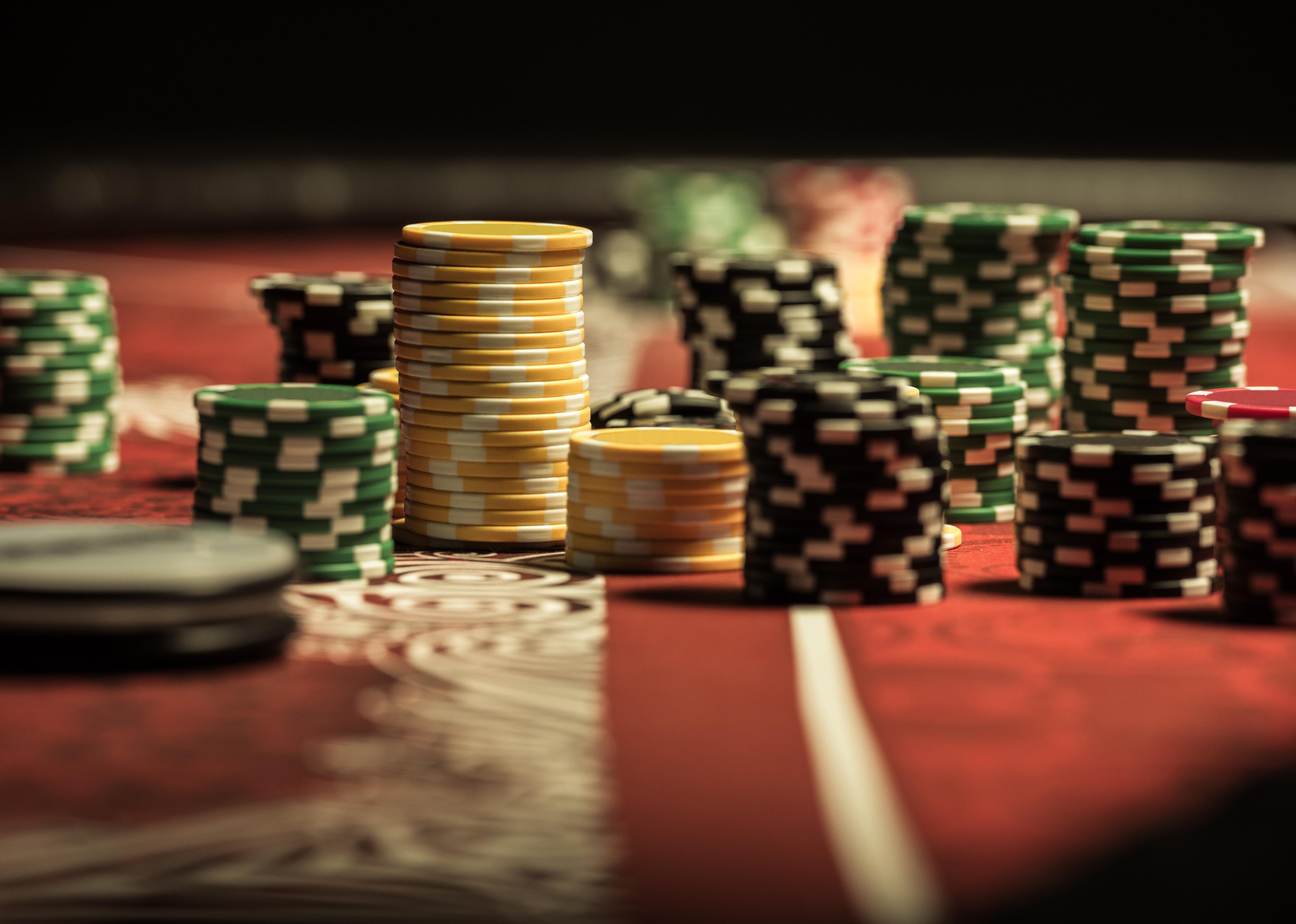 Close-up view of poker chips on poker table at casino.
