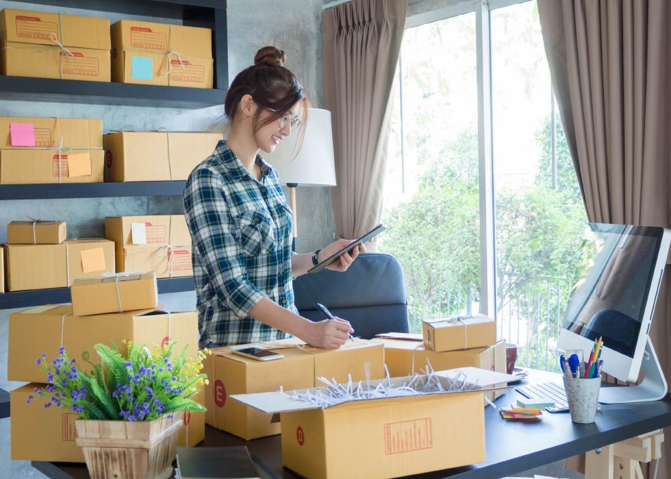Young business woman working online