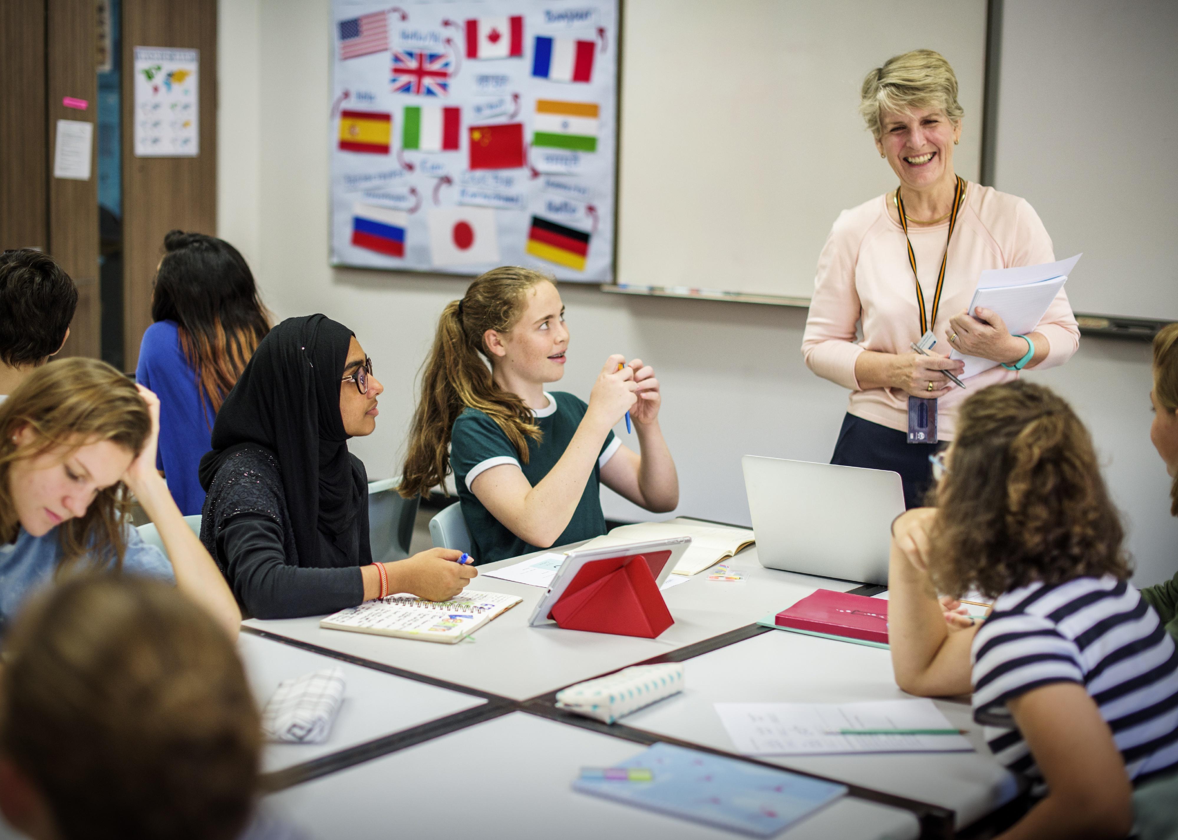 Teacher standing above a group of sitting students