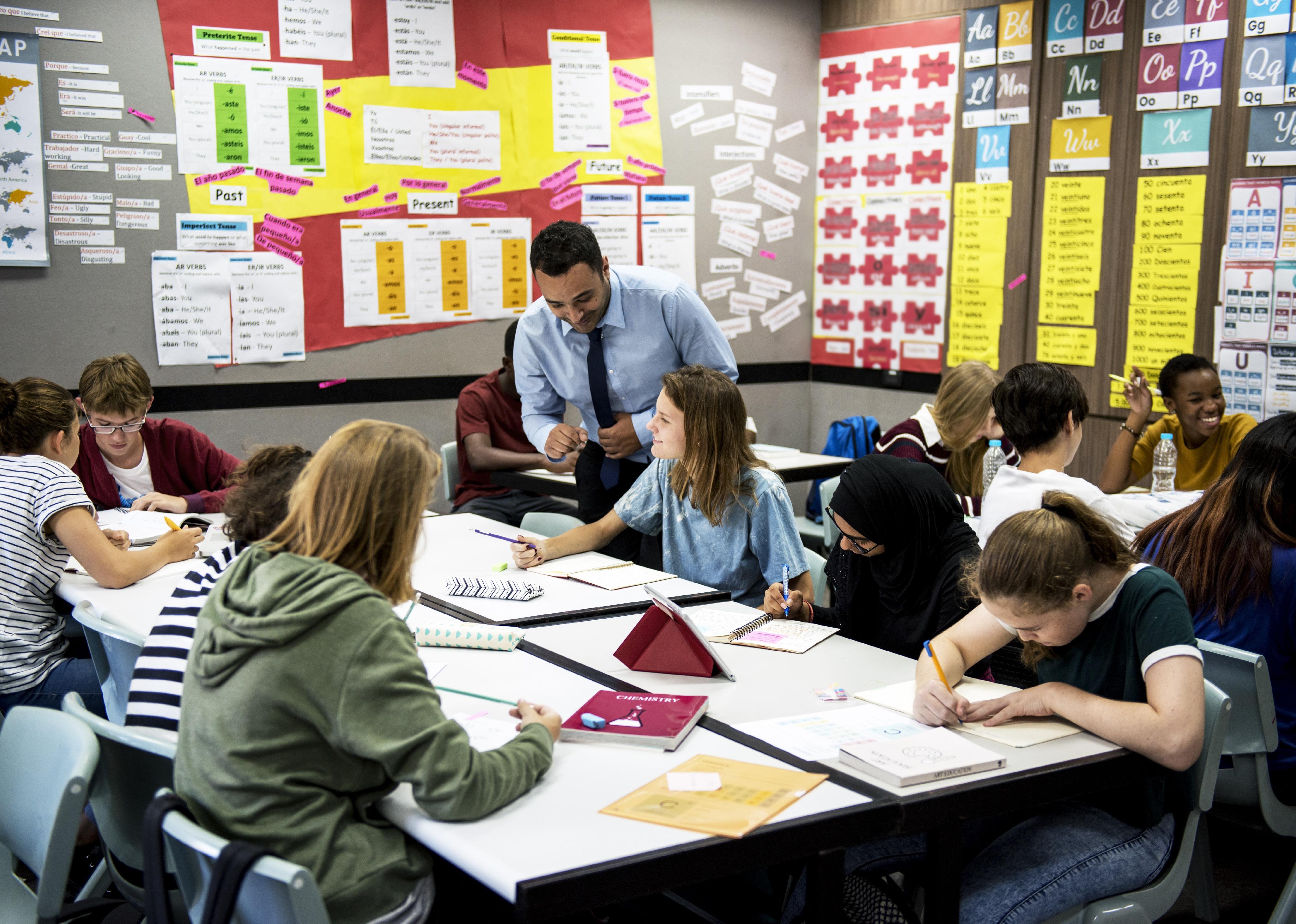 Group of students learning in classroom