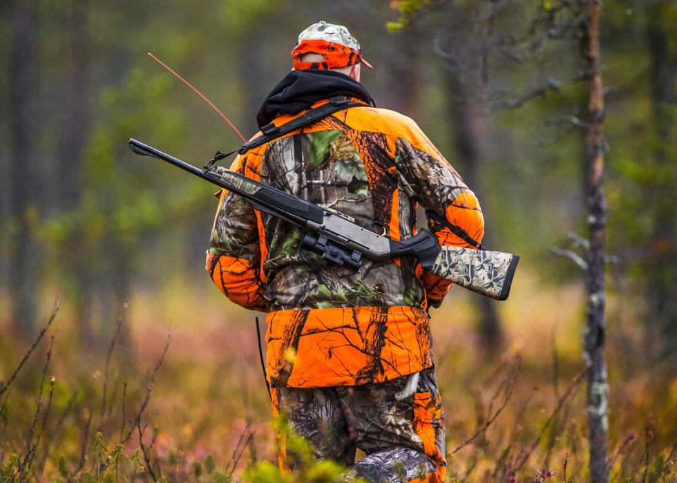 Hunter walking in the fall hunting season.