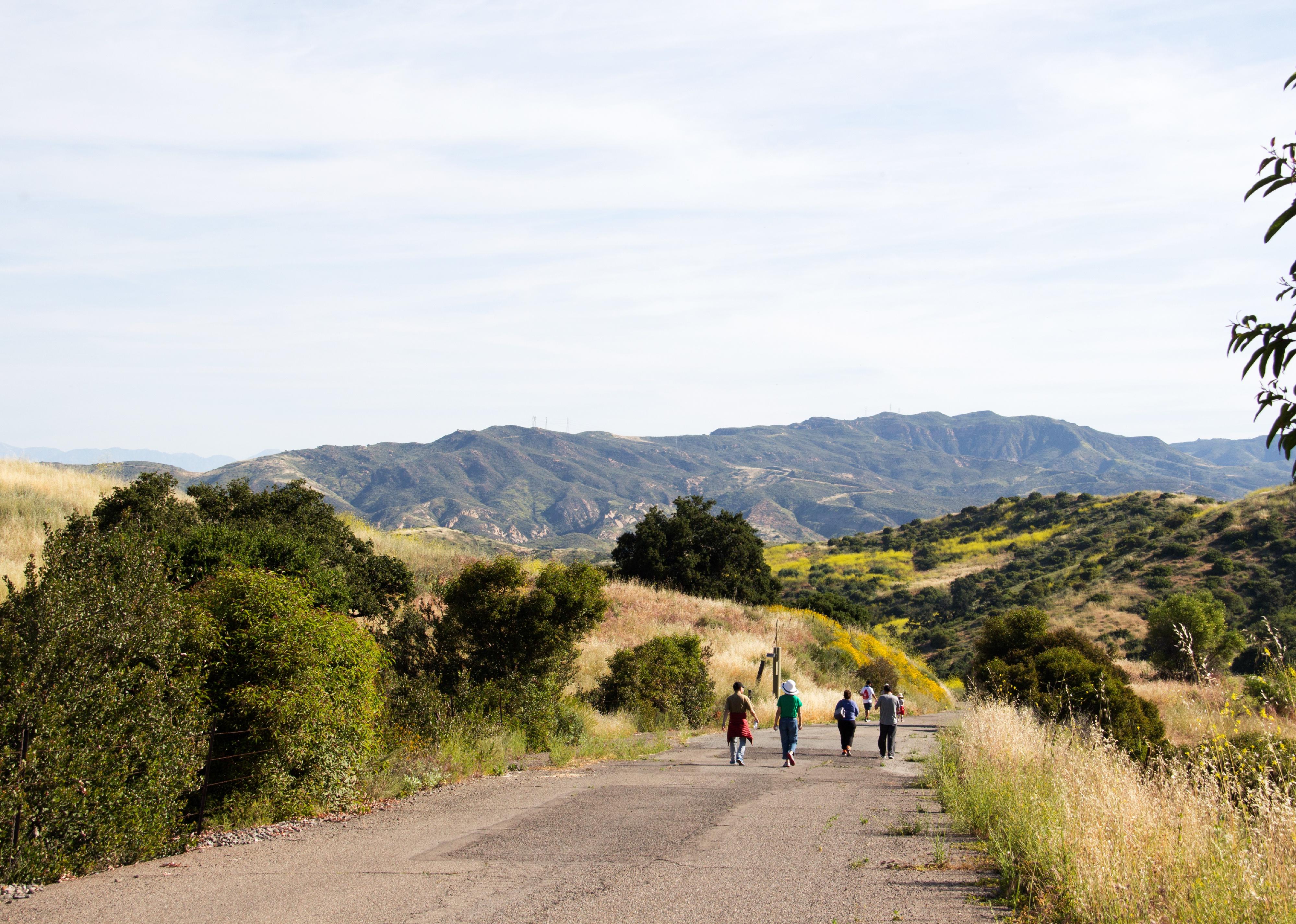 People walking on hiking trail in Irvine Open Space Park.